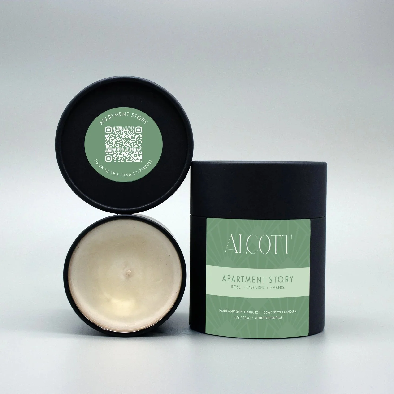 Clean burning candle Apartment Story next to it's plastic-free packaging.