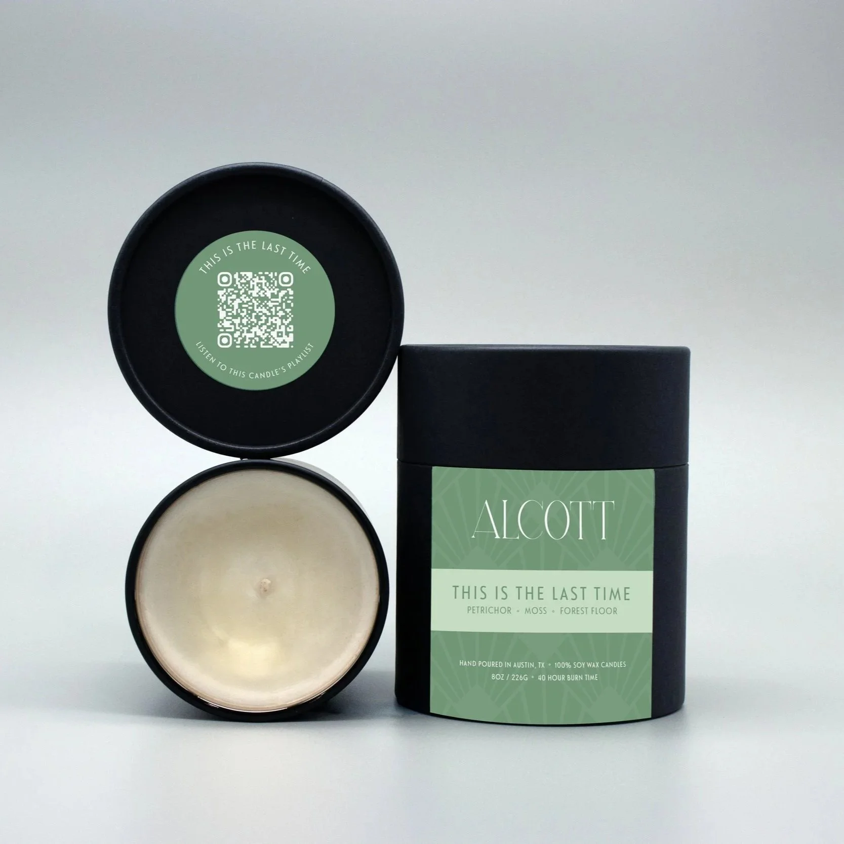 Clean burning candle The Last Great American Dynasty next to it's plastic-free packaging.