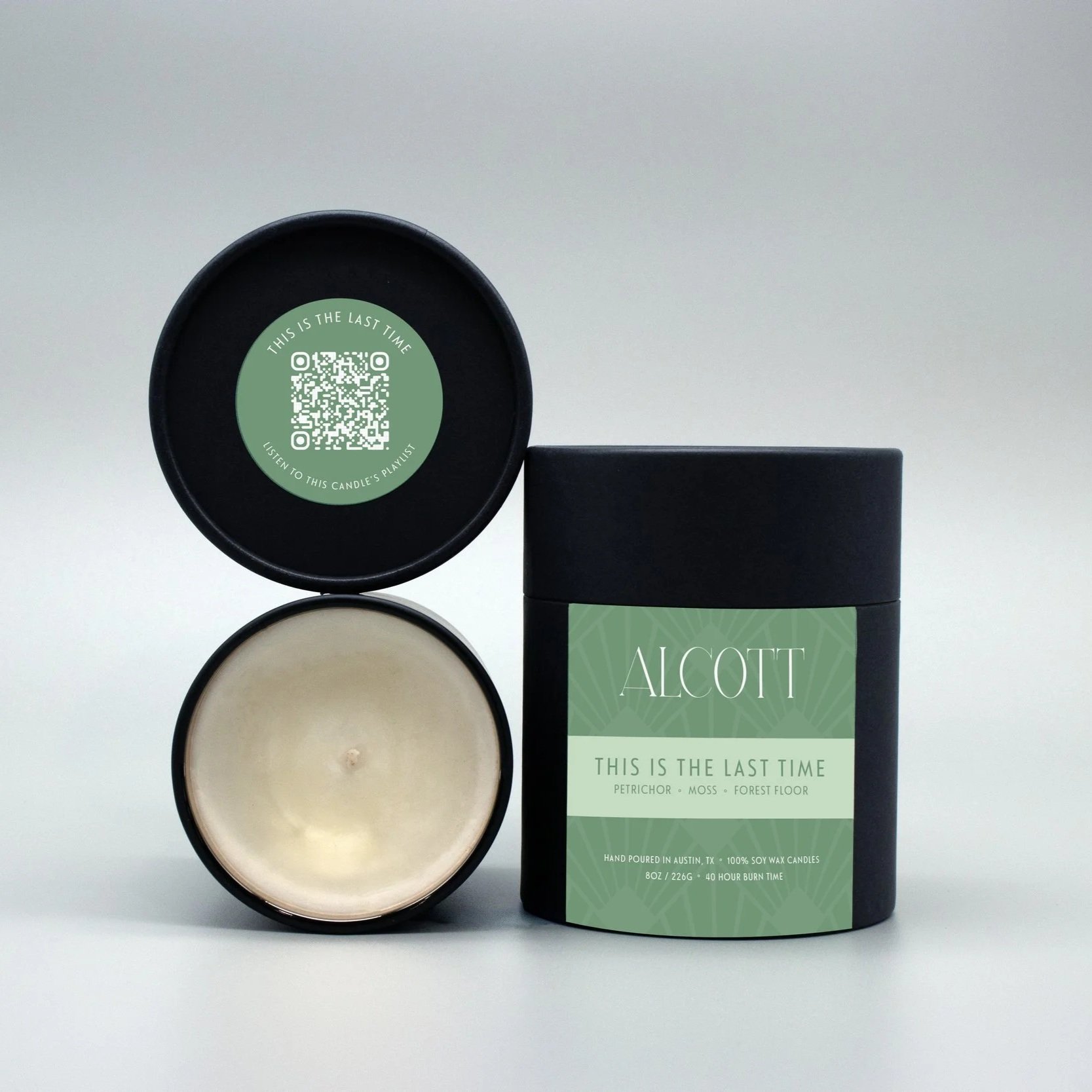 Clean burning candle This Is The Last Time next to it's plastic-free packaging.