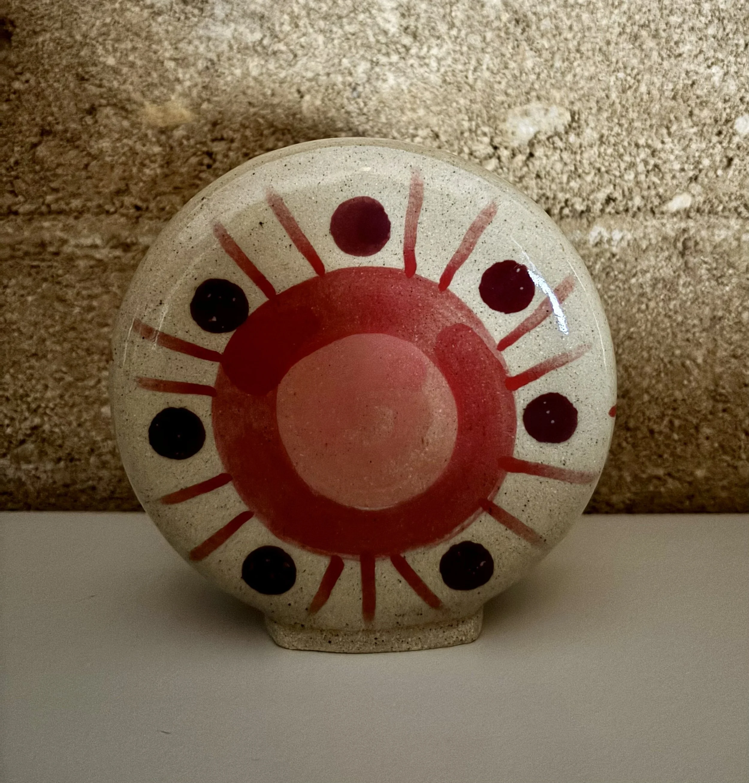 Disc vase in earthy red - front.jpg