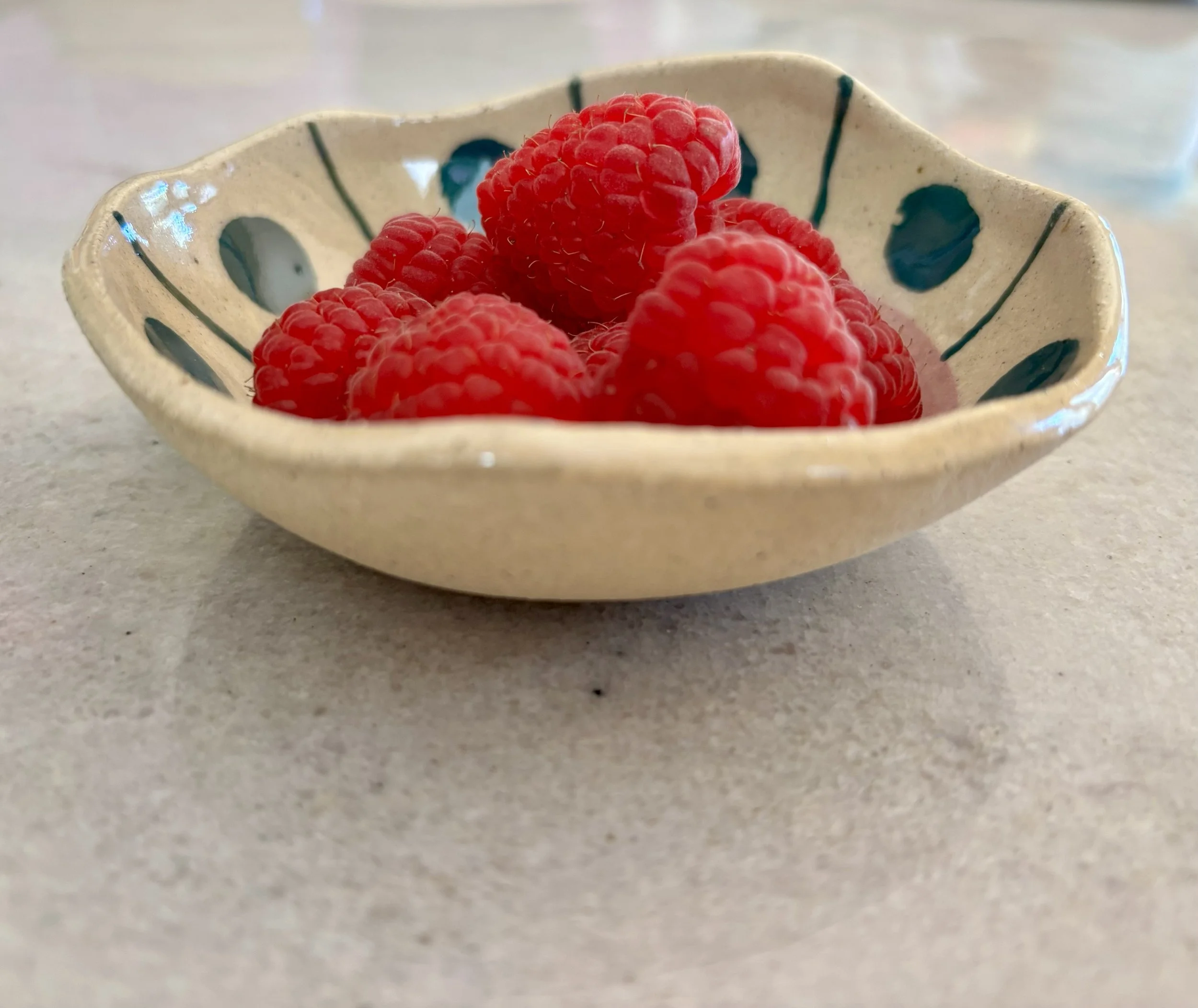 Tiny bowl with raspberries.jpg