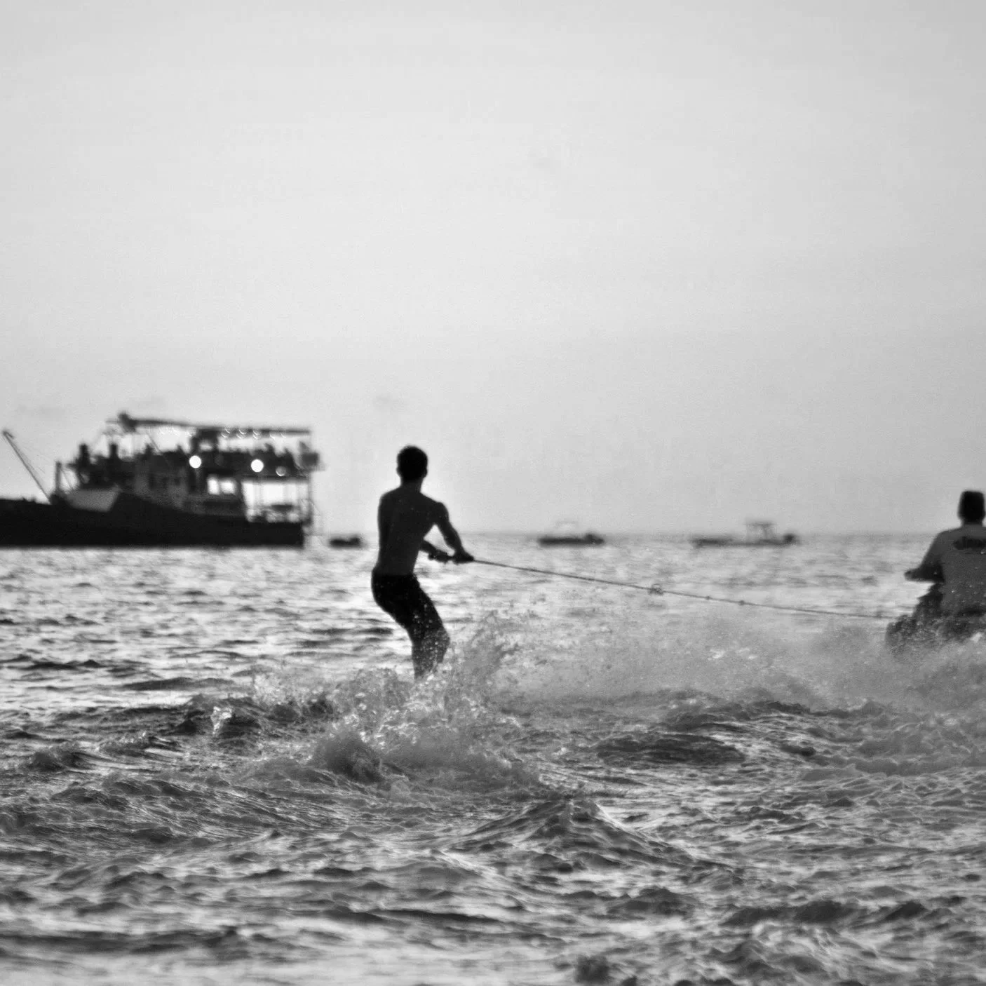 Steve Roberts coming back to the ship after a tow-in session in Uluwatu