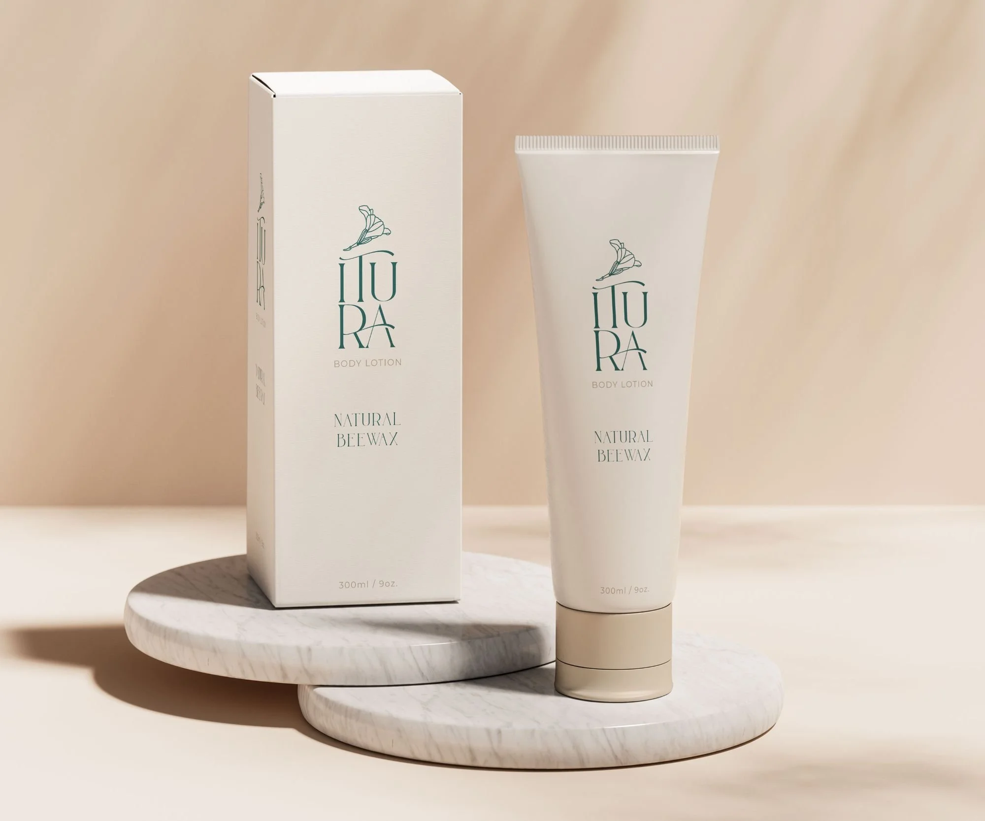 A white tube of Itura Body Lotion and its matching box, both labeled 'Natural Bee Wax,' placed on a marble platform against a beige background.
