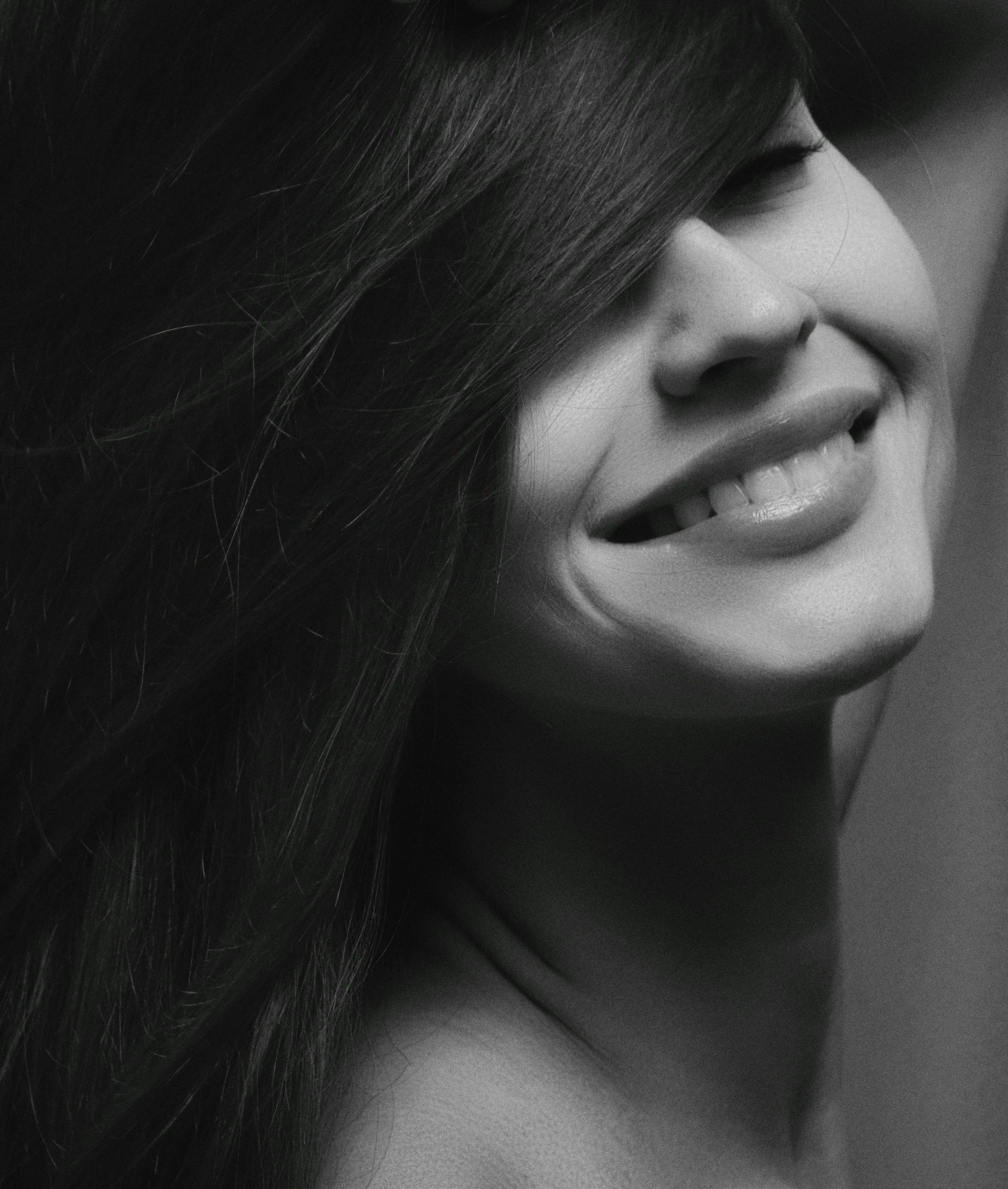 a smiling woman happy with her beauty brand identity