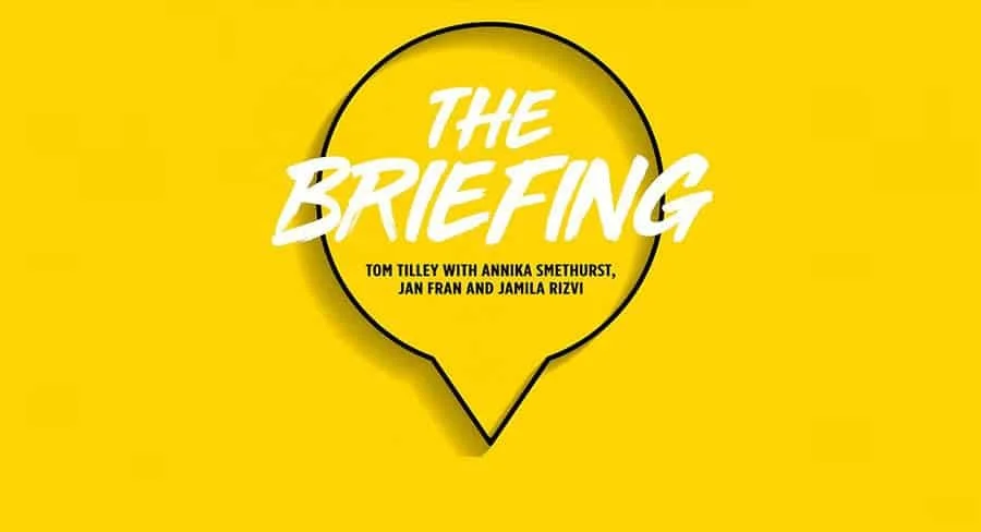 A graphic with a yellow background featuring a circular speech bubble with a black outline. Inside the speech bubble, the text reads 'The Briefing' in large white letters, followed by smaller black text listing Tom Tilley with Annika Smethurst, Jan Fran, and Jamila Rizvi.