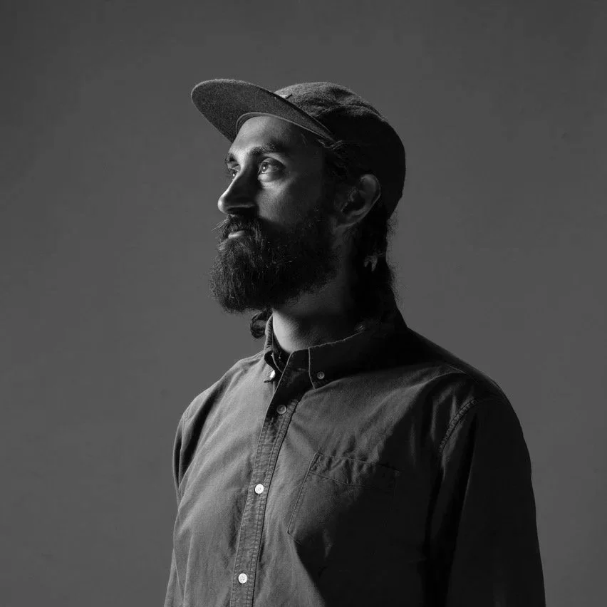 Black and white portrait of Neil Sharma.