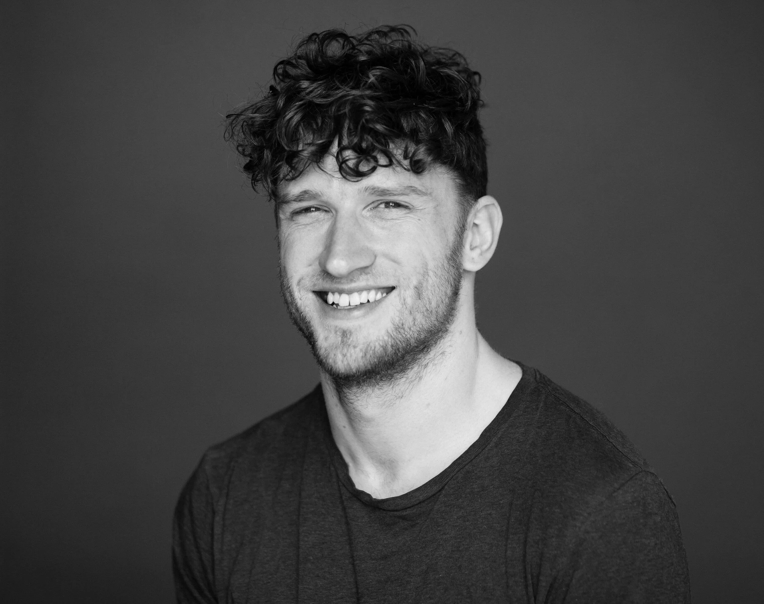 A black and white portrait of Declan Greene.