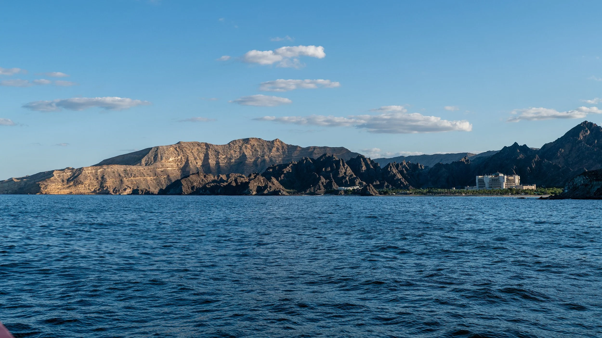 Coast_near_Muscat_with_Al_Bustan_Palace_Hotel.jpg