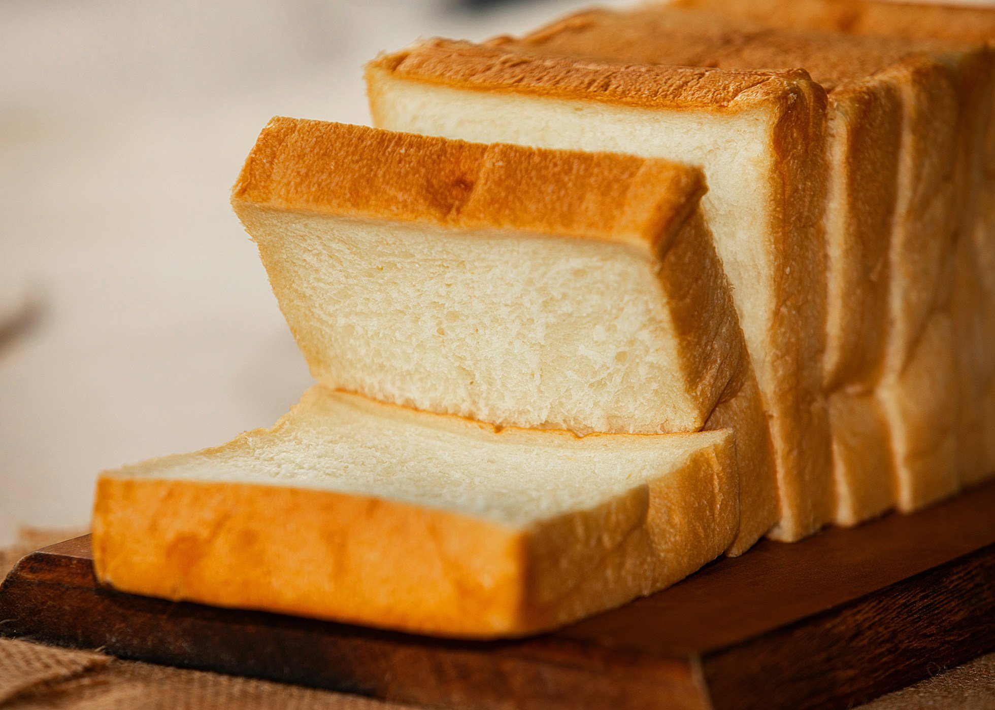 Thick sliced white bread on a chopping board