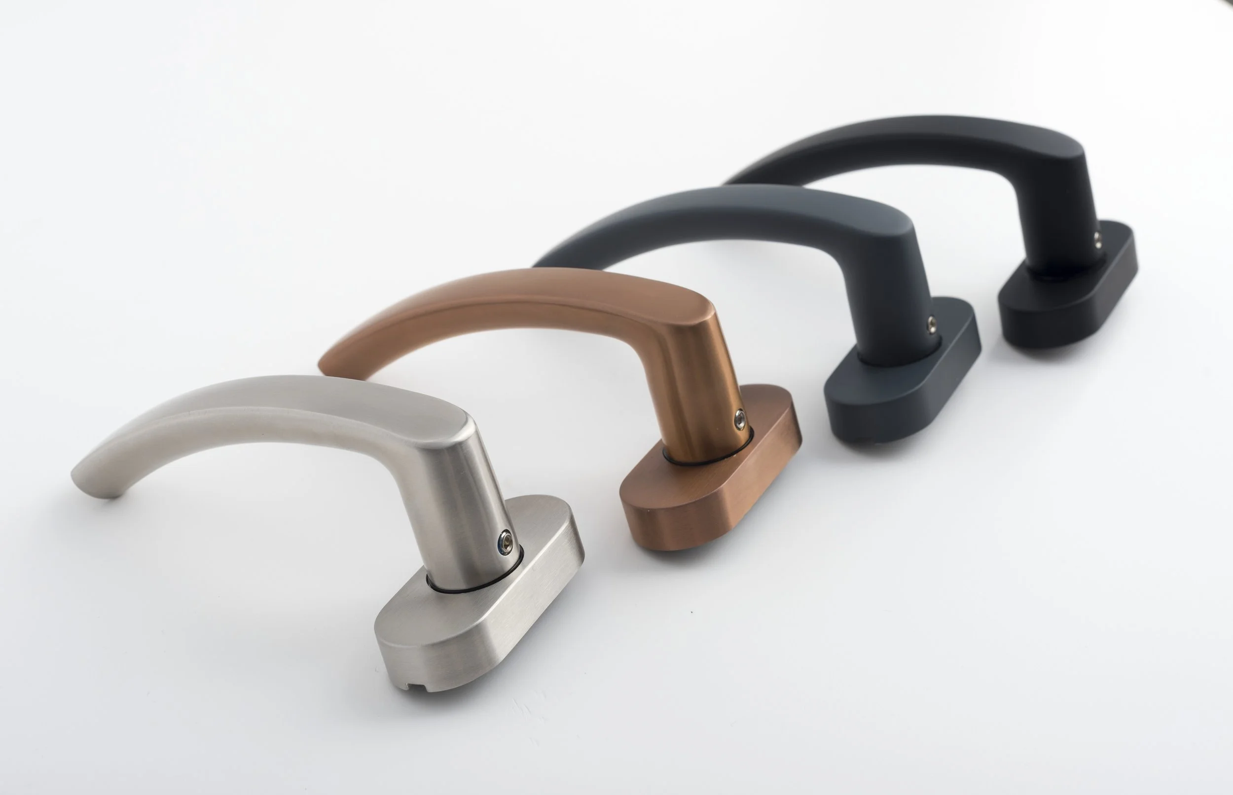 Four modern cabinet handles in brushed stainless steel, bronze, matte black, and black finish, arranged in a row on a white surface.