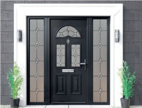Black front door with decorative glass panels, flanked by two potted green plants