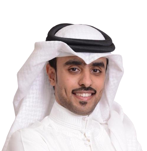 A man wearing traditional Middle Eastern attire, including a white thawb, and a white headscarf with a black agal, smiling at the camera.