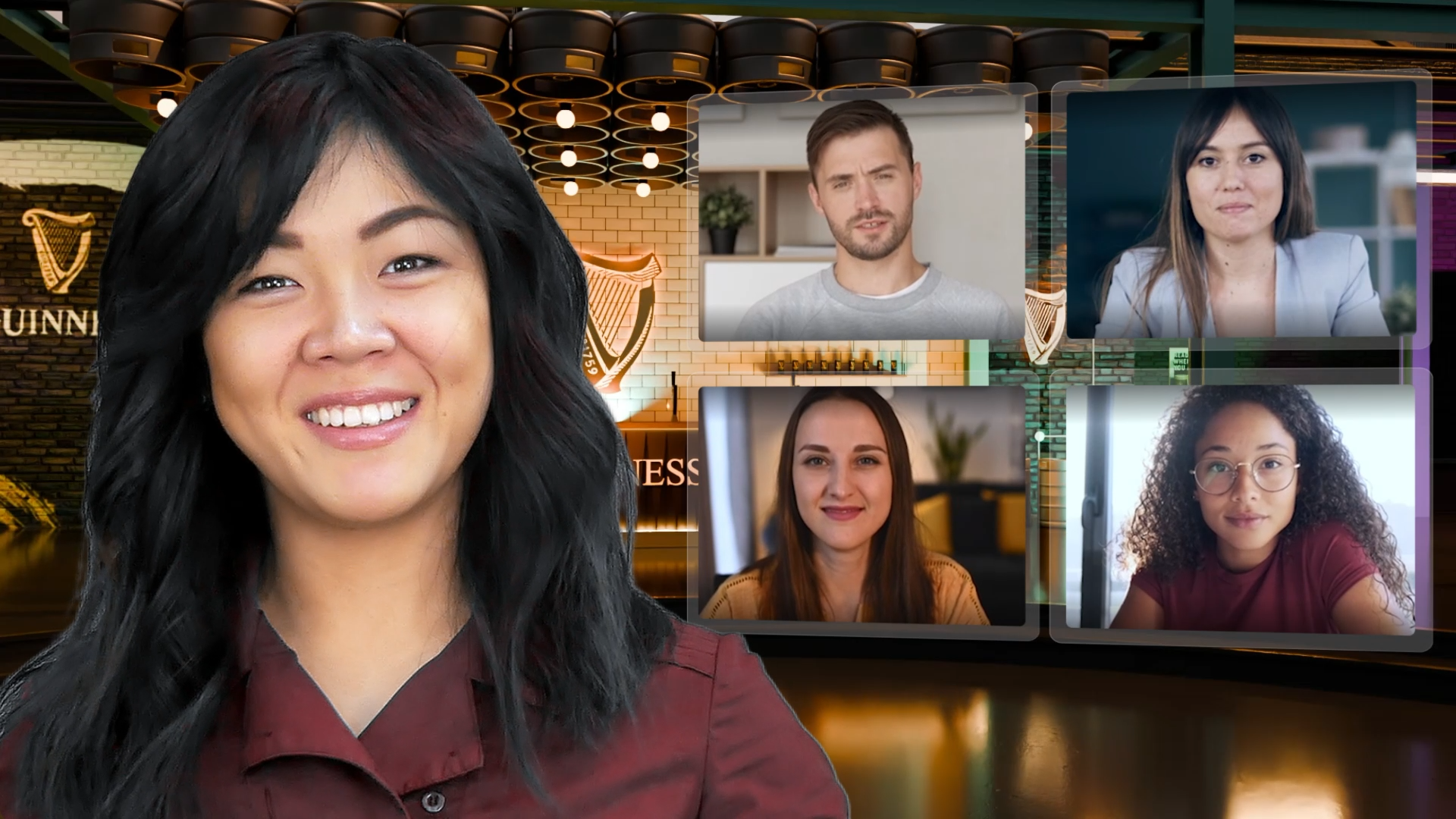 A woman with long black hair smiling at the camera in front of a virtual background of a bar with Guinness signs and a video call with four participants.