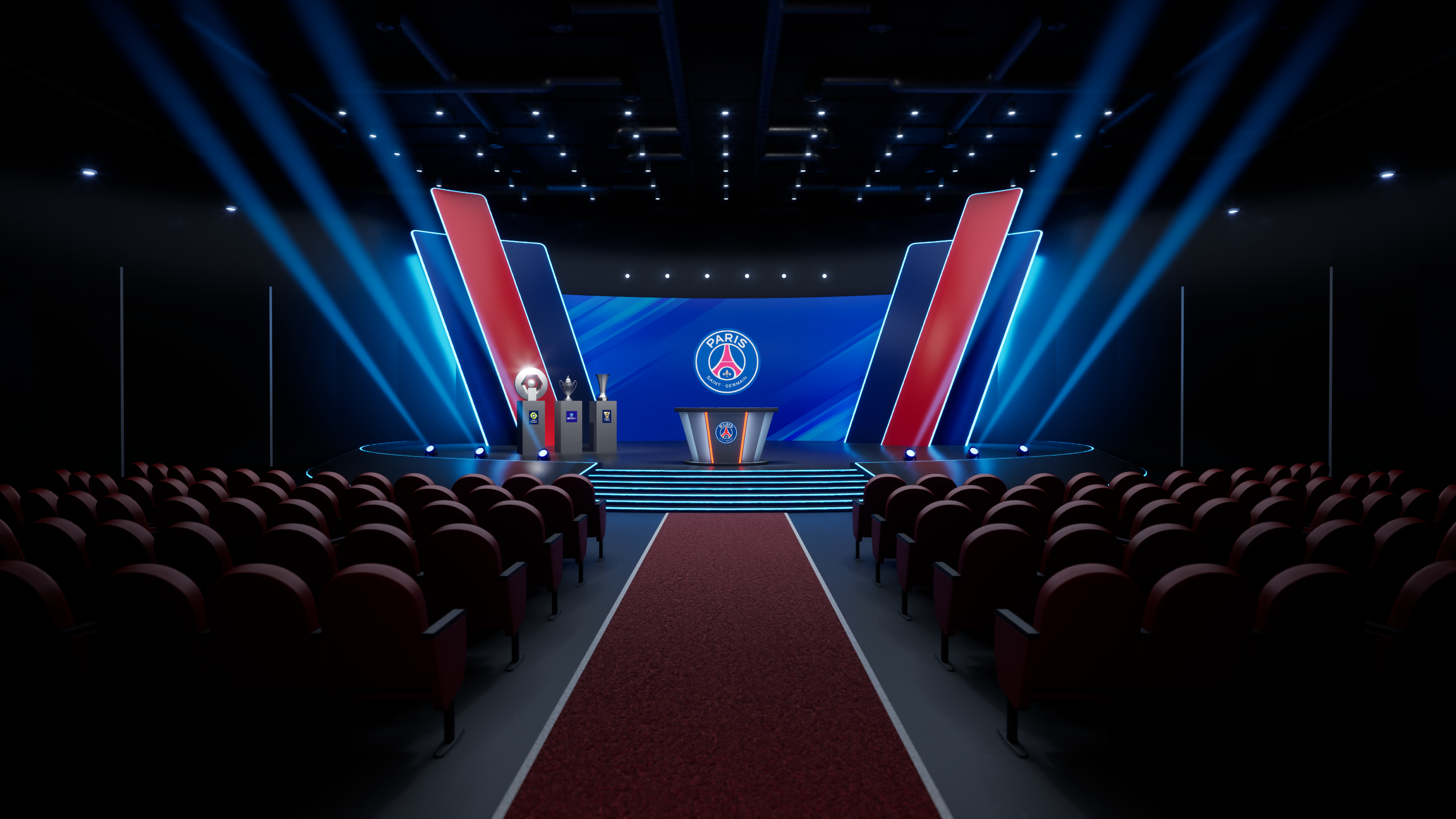 Stage set for an awards ceremony with Paris Saint-Germain (PSG) logo, trophies, and soccer ball, illuminated with blue and red lighting, and a red carpet leading to the stage.