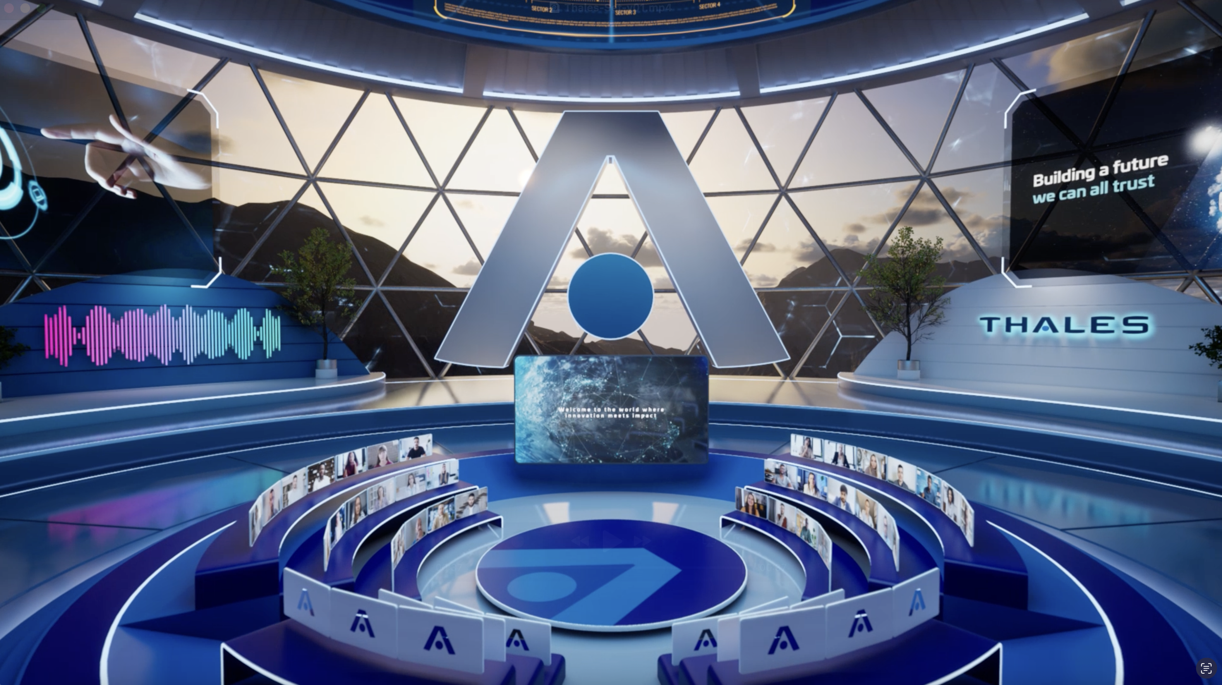 A futuristic conference or presentation stage with a large central logo resembling an 'A' and digital screens displaying text about Thales and building a trustworthy future, surrounded by tiered seating with virtual attendees and a modern geometric window showing a mountain landscape.
