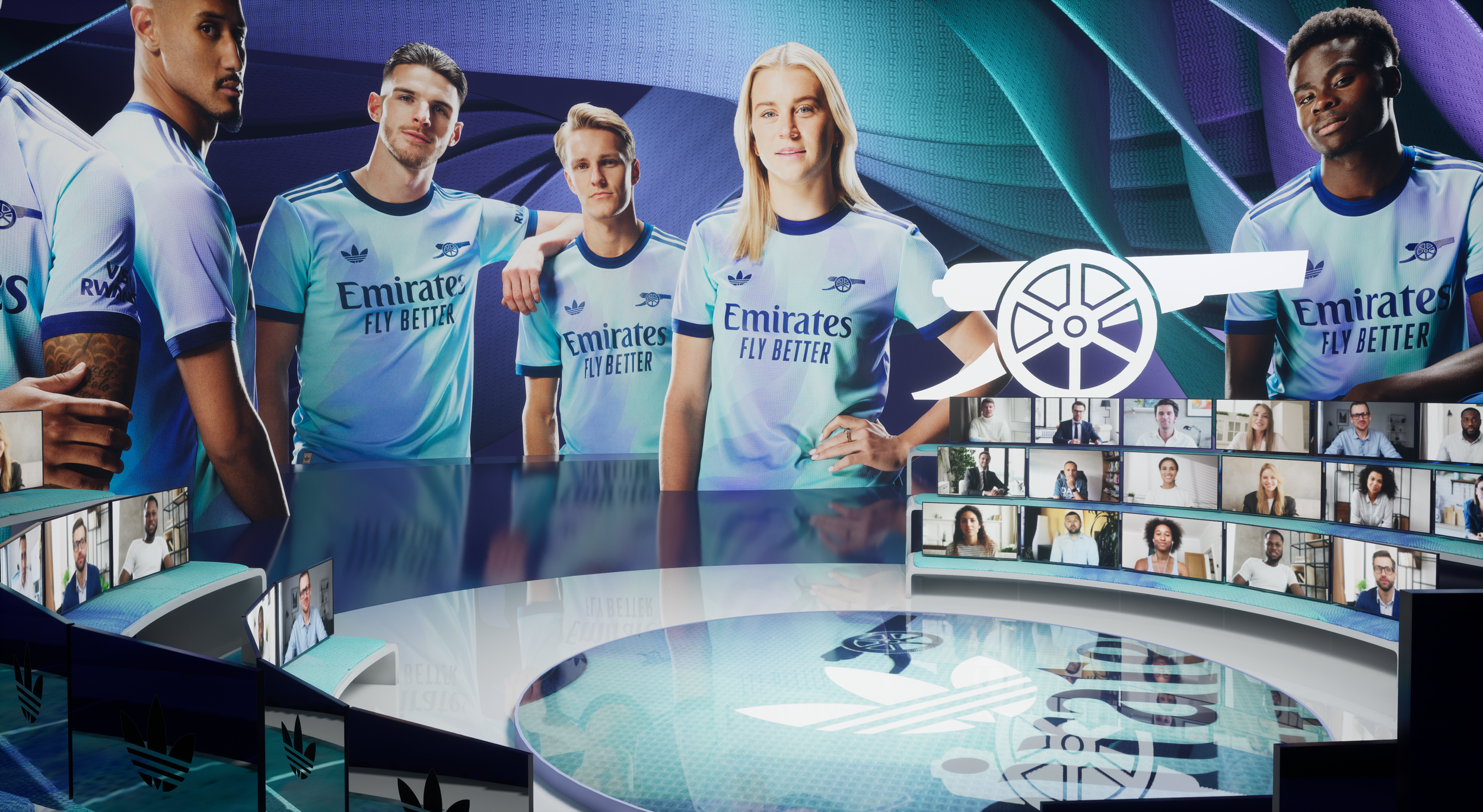 A virtual presentation with five people wearing soccer jerseys featuring the Emirates logo, standing in front of a large digital screen and surrounded by smaller screens showing remote participants.