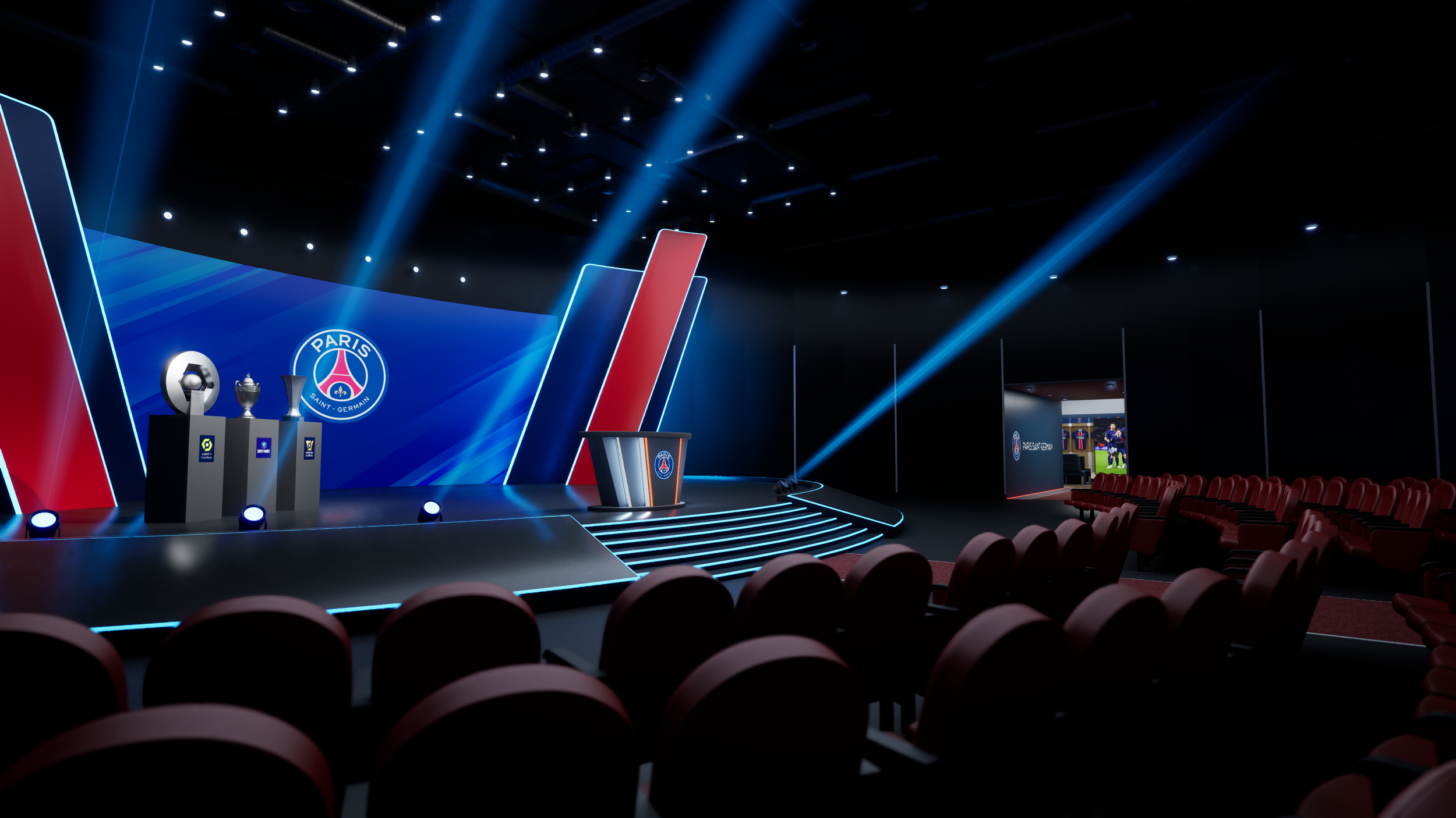 An empty auditorium stage with Paris Saint-Germain football club logo, trophies, a podium, and blue stage lighting.