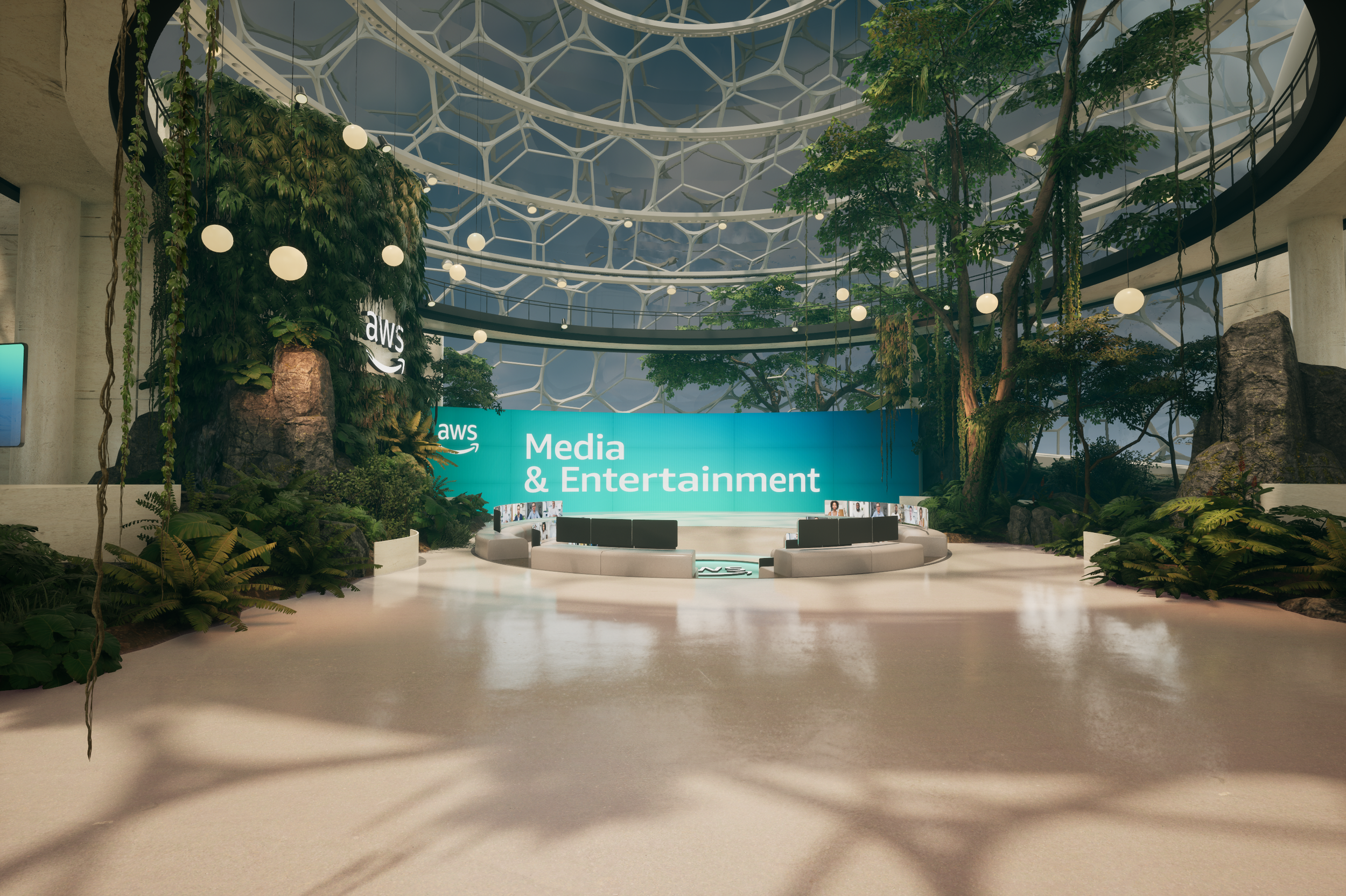 Lobby area with a large digital sign reading 'Media & Entertainment' at an AWS event, surrounded by lush greenery and trees inside a modern glass building.