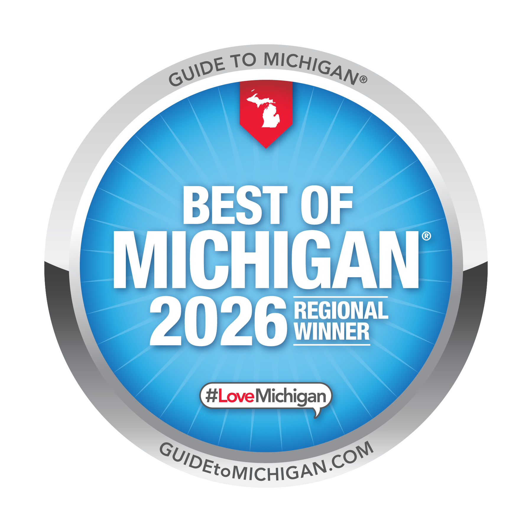 Circular badge with blue background and white text that reads 'Best of Michigan 2026 Regional Winner.' At the top, a red banner with a white silhouette of Michigan. At the bottom, a hashtag #LoveMichigan and website URL guide to michigan.com.