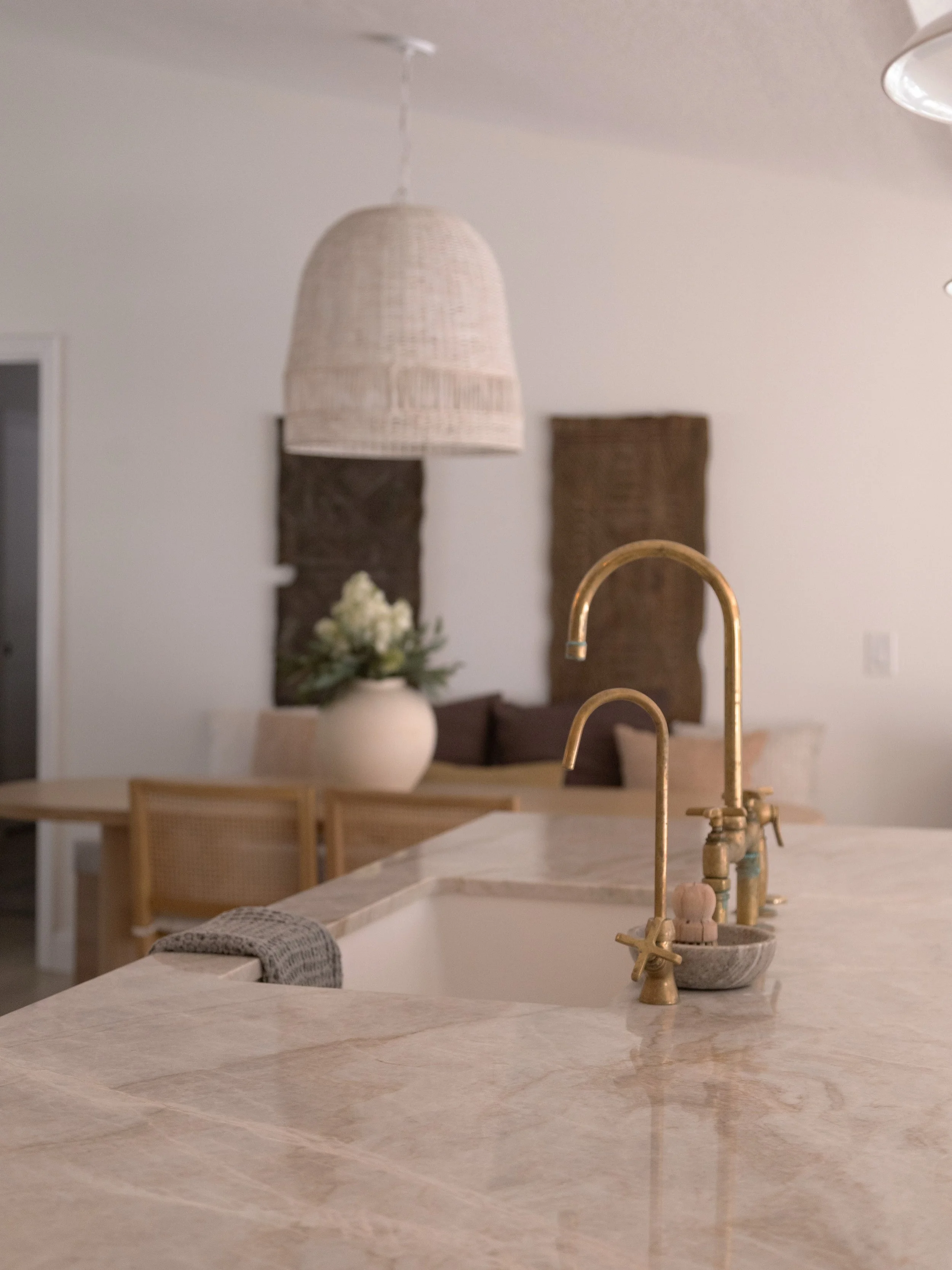 From the original layout to a completely reimagined space.

This renovation was all about creating a more open, functional home while bringing warmth and character into every detail.

Natural stone, custom cabinetry, aged brass finishes, and thoughtf