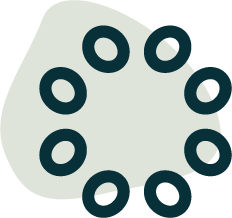 JoyWell Fitness Logo. Close-up of a green object with seven circular holes around its edge