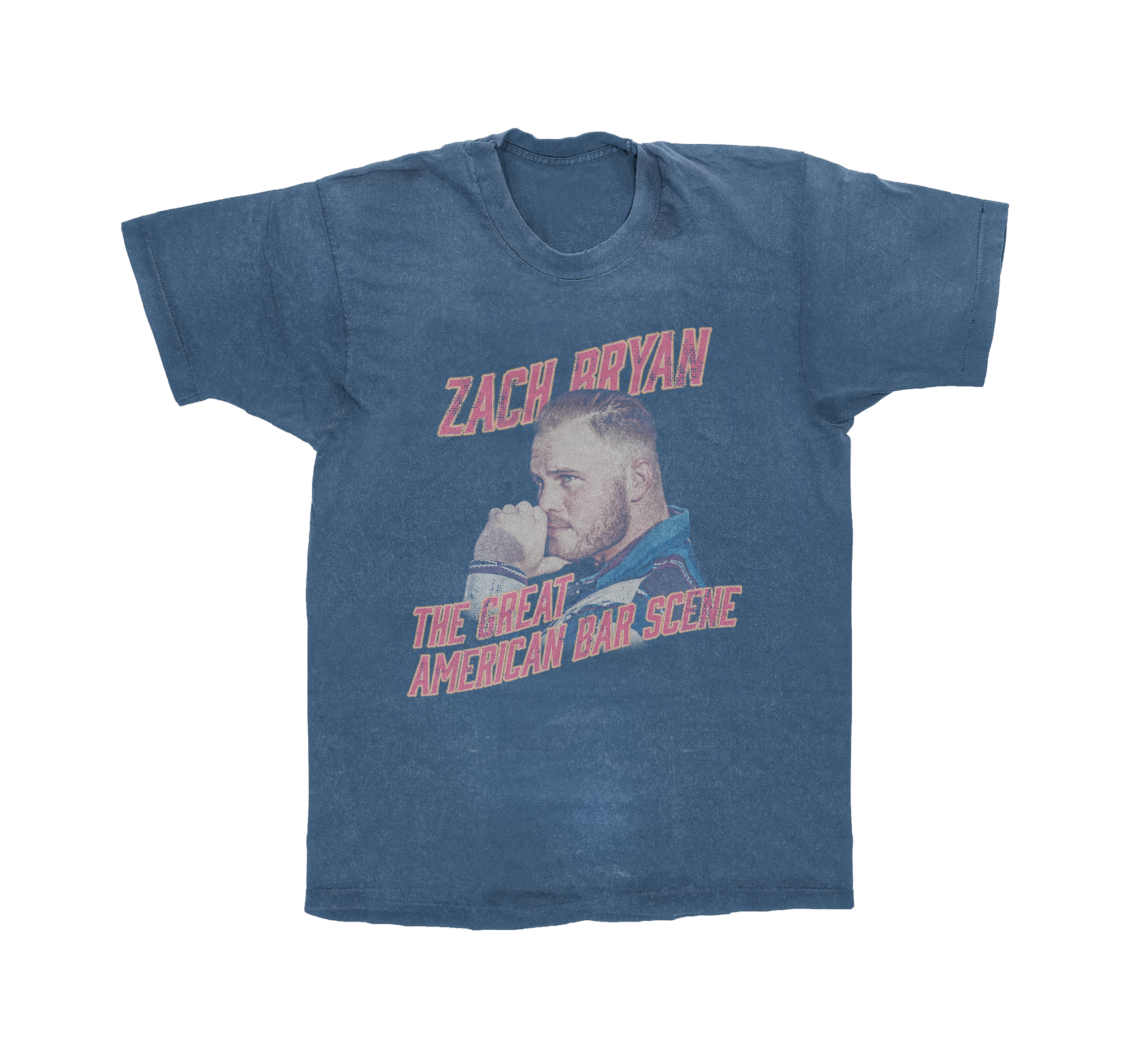 A blue T-shirt featuring a printed image of a man with short hair and a beard, with his arm against his face, and the text 'ZACH BRYAN THE GREAT AMERICAN BAR SCENE' in pink and red fonts.
