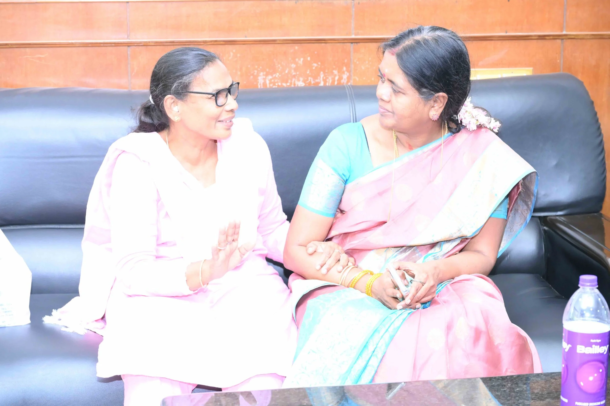 Spouses of Jag (Rachel Usharani) and APK (Latha).