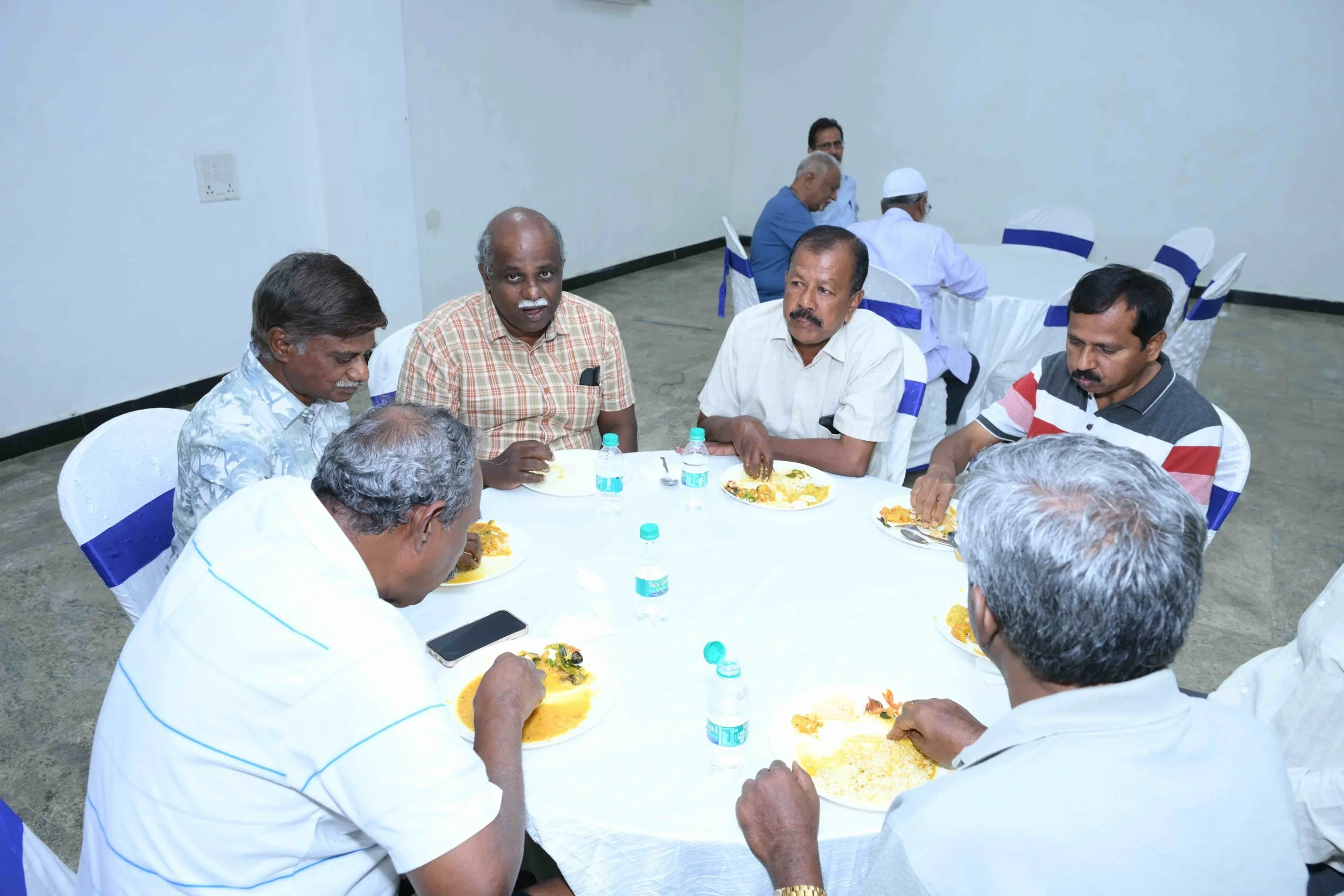 Amuthan, Lekshmanan, Kamalesh, Manix and Packirisamy rounding the table.