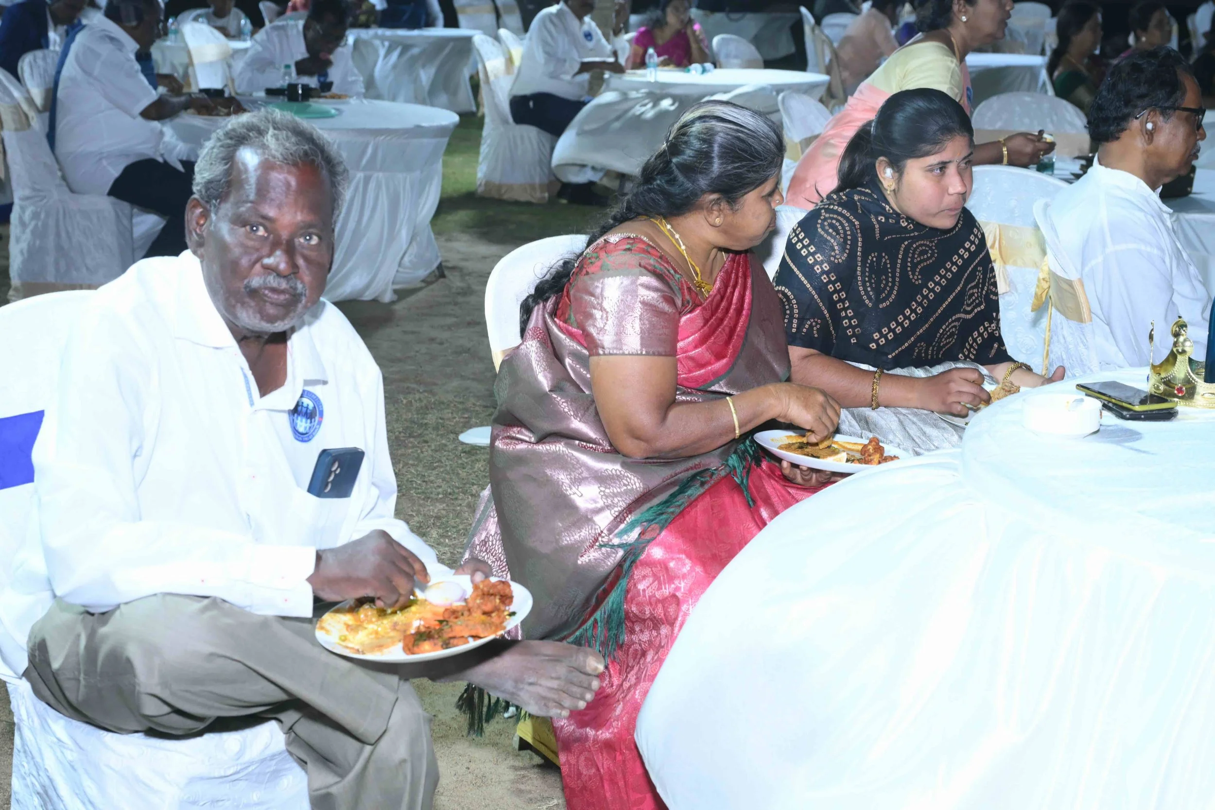 Palanisamy and family tasting it.