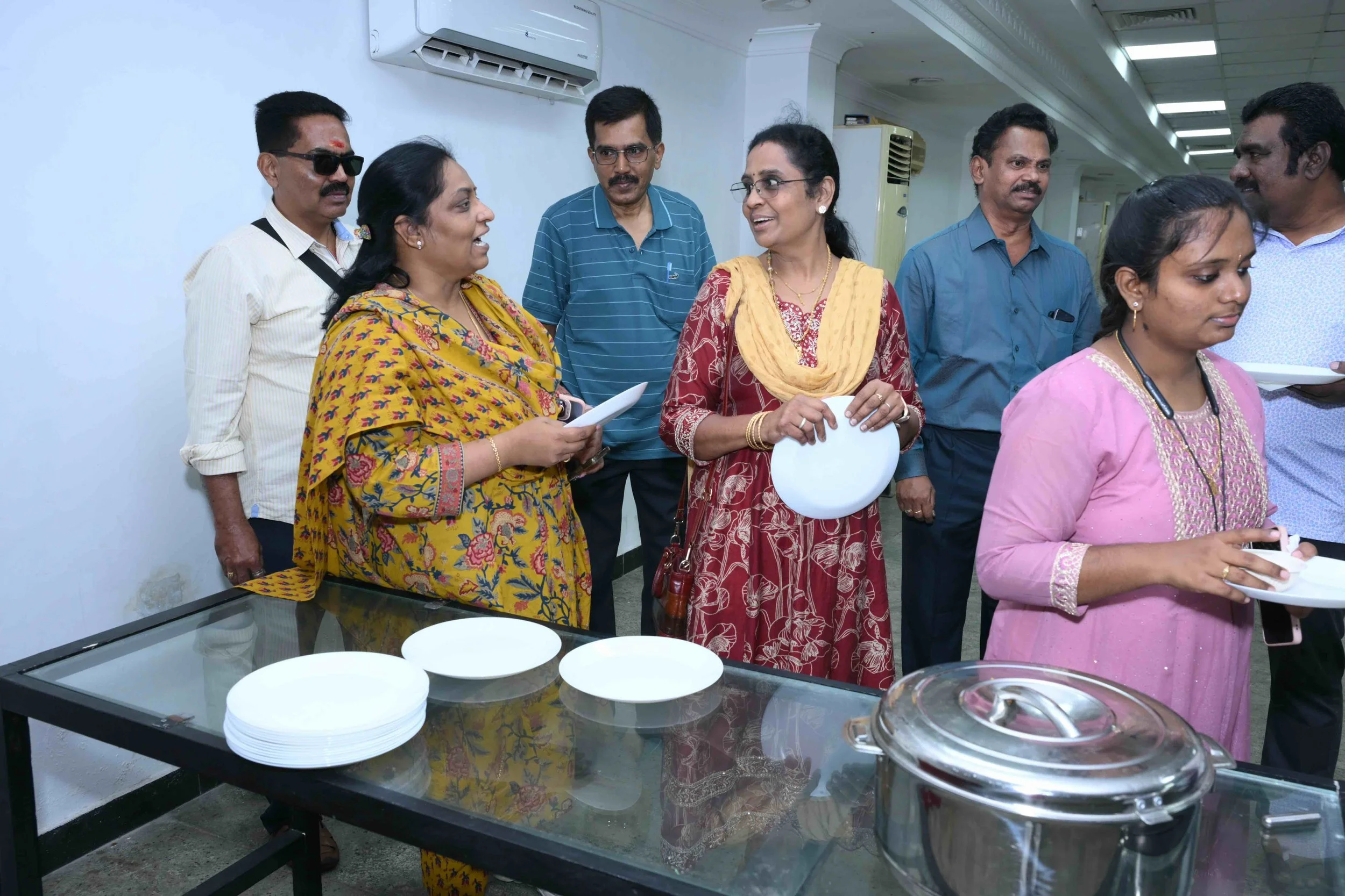 Sathya, Sujatha, Pedro, Celena, Gothand and Prakash are happy to be at the luncheon.
