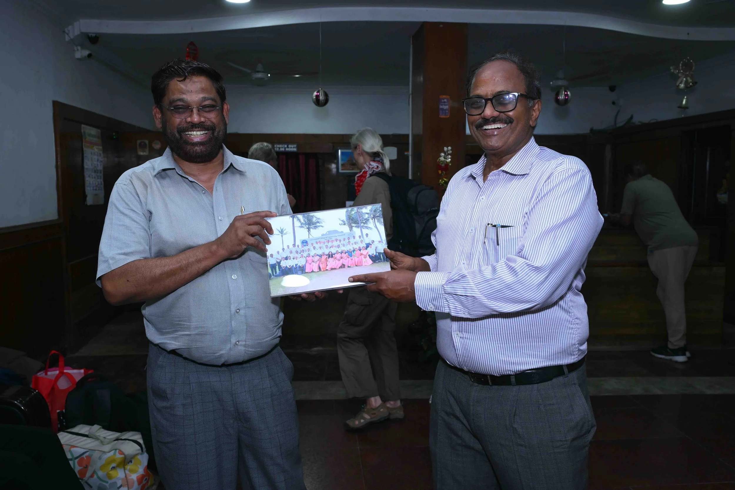 A.J and 1000Raja parting with a memorable picture in hands.