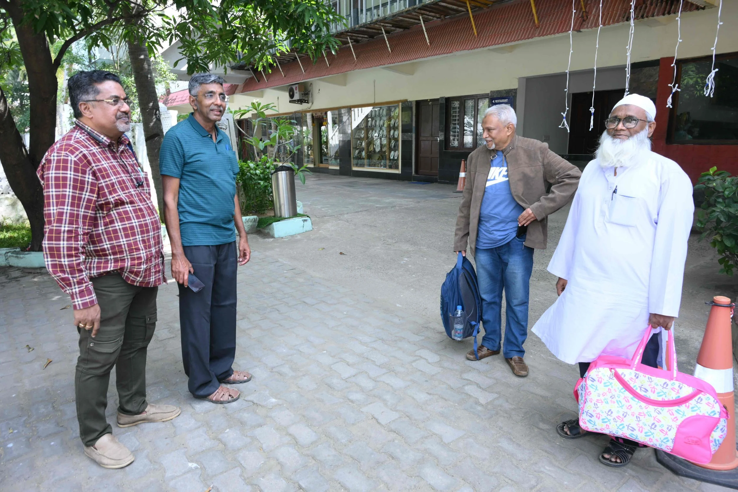 Syed Abuthahir arrives and the other three are thrilled.