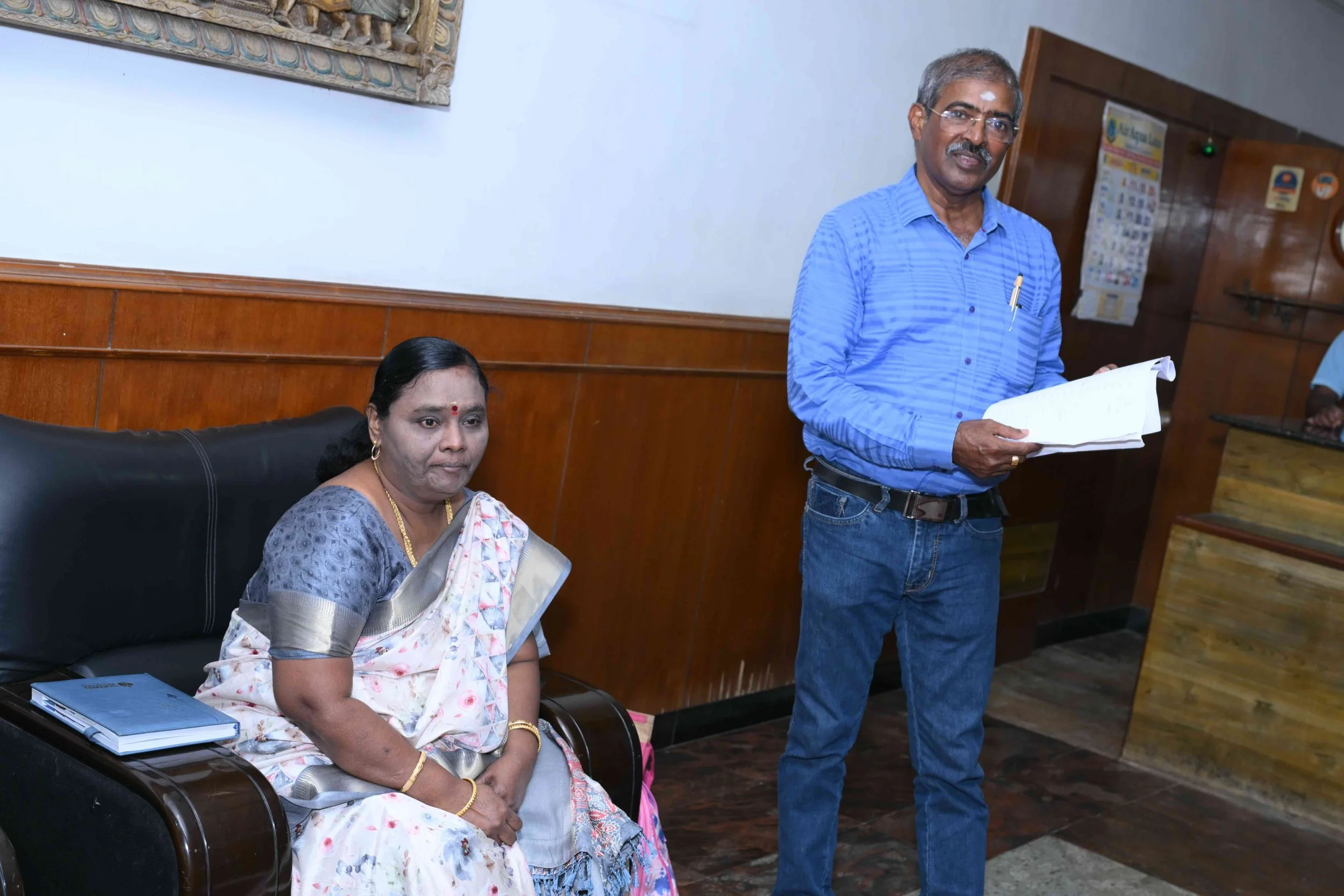 Sekar gives Rani a prominent seat where he has been sitting all morning.