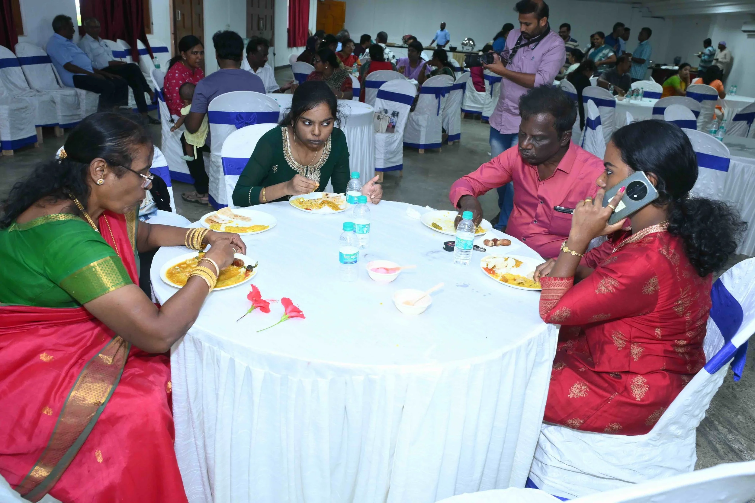 Selvapackiyam and family tasting it.