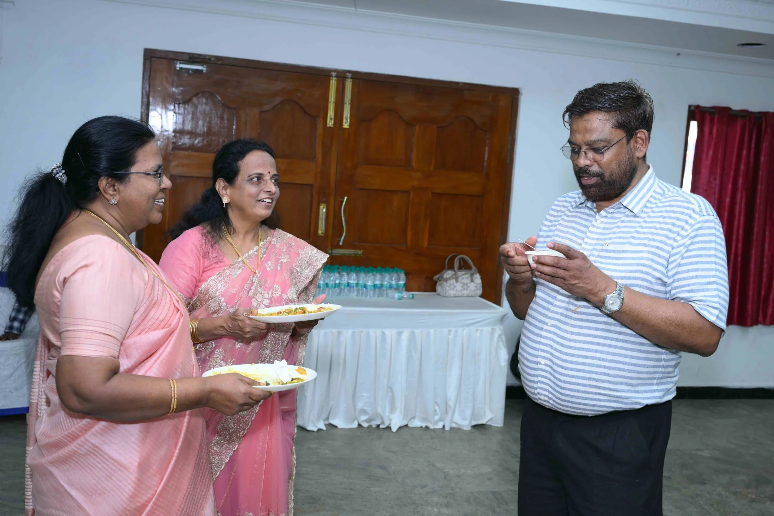 A.J talks for Celine and Latha to listen curiously.