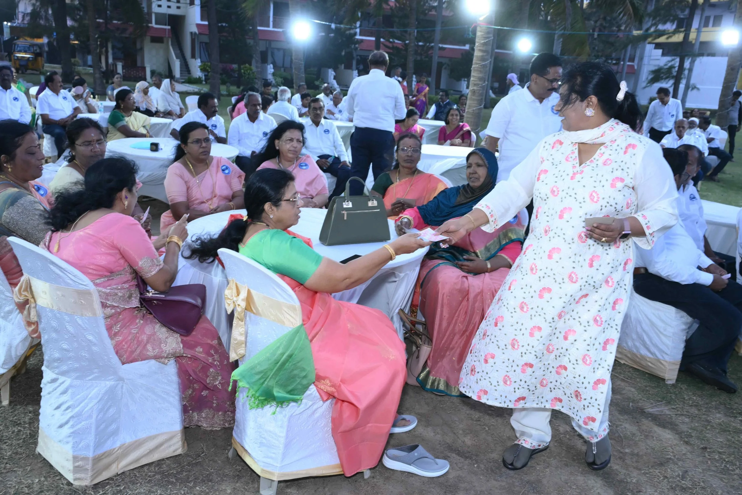 Sujatha gives a quiz to the ladies.