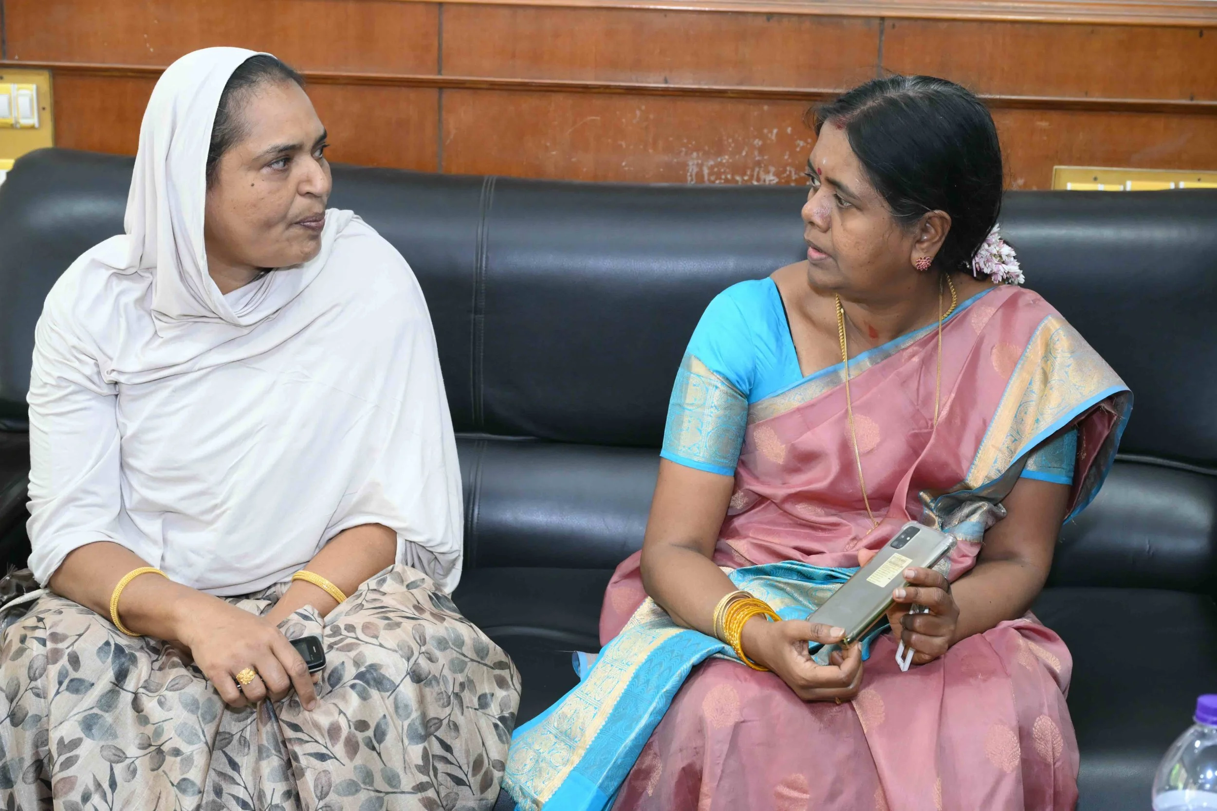Latha is talking to Dharvish's wife K.H.Begum.