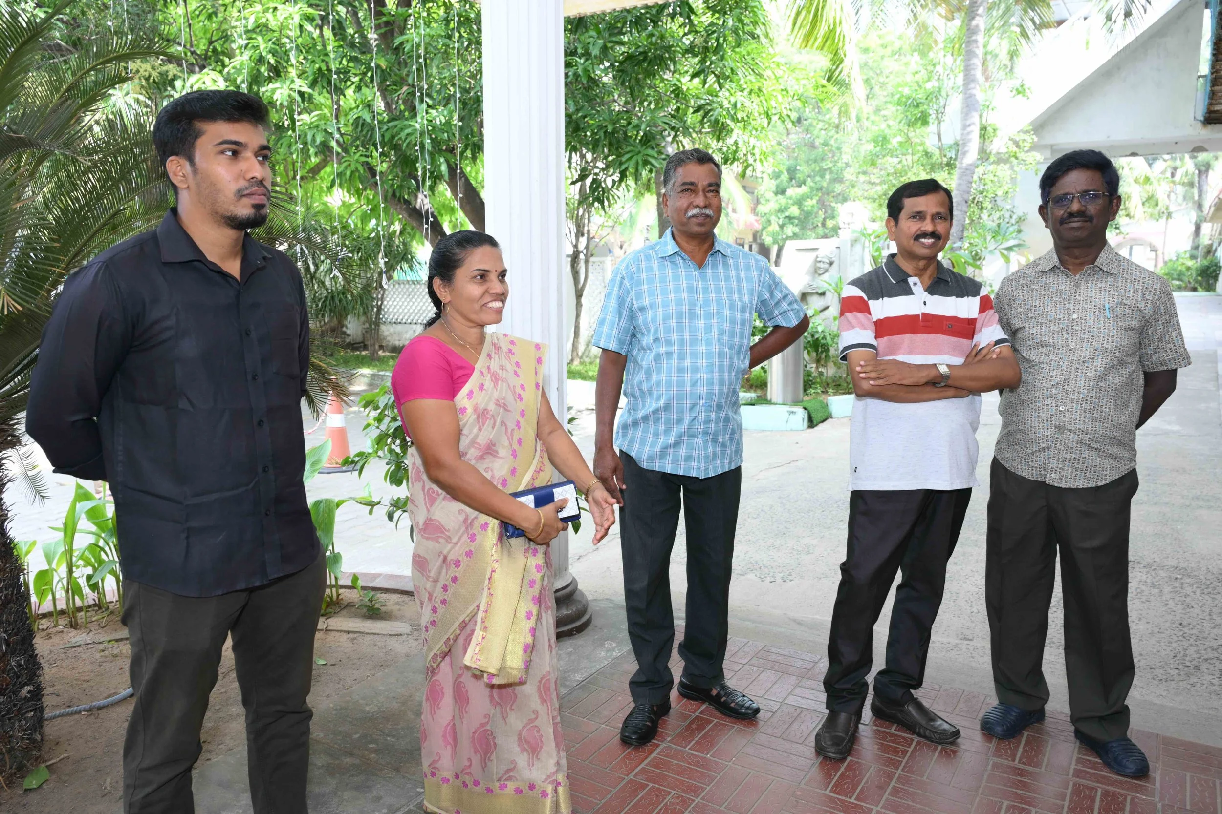 Michael Pushparaj + Sobia arrive with their son Frank.