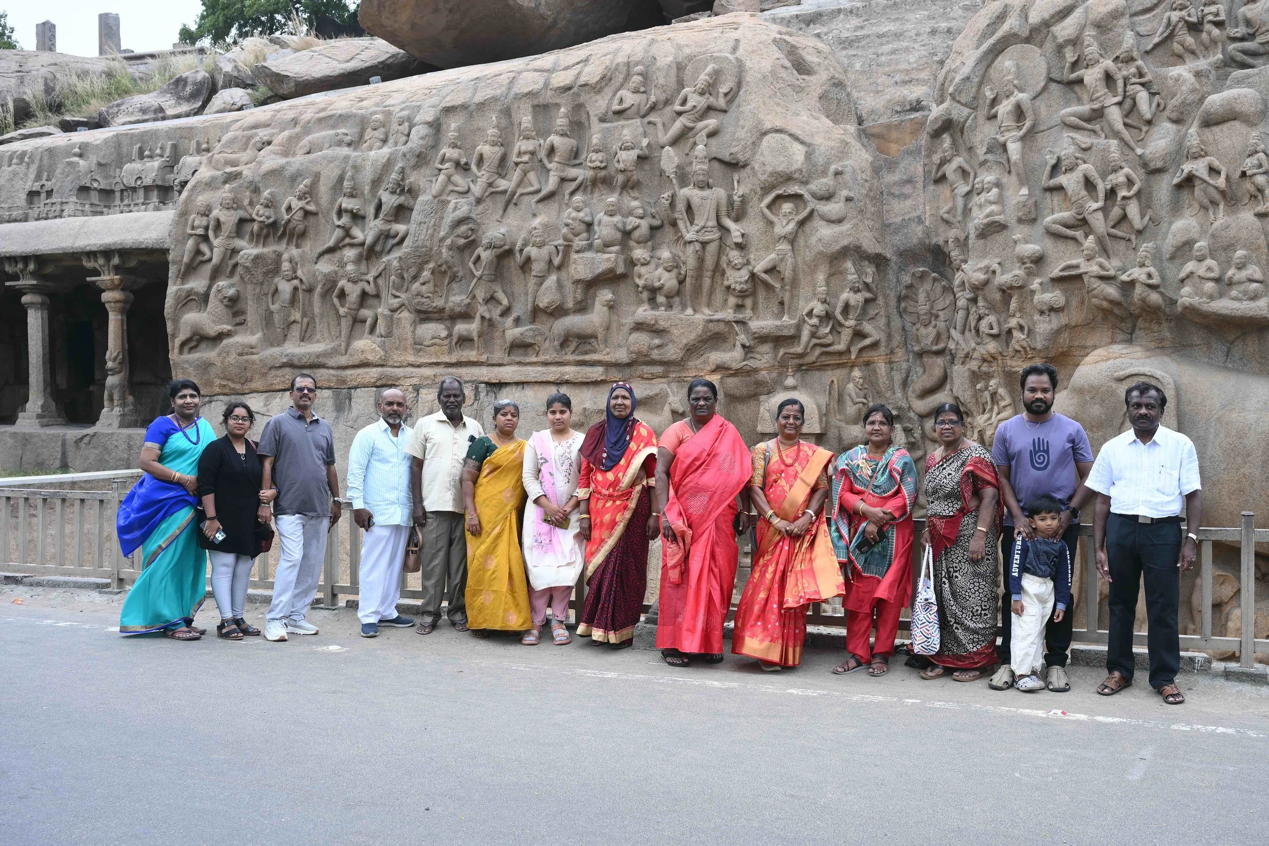 Beautiful group with a beautiful wall behind them.