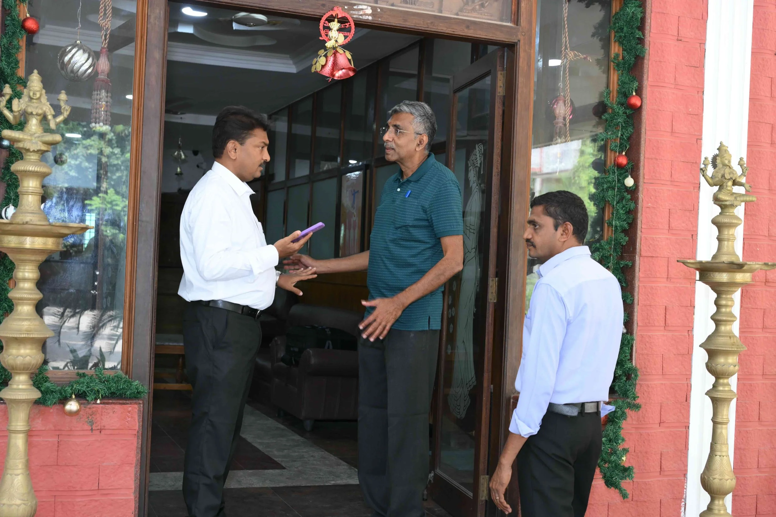 Palanikumar is all business with the hotel staff.