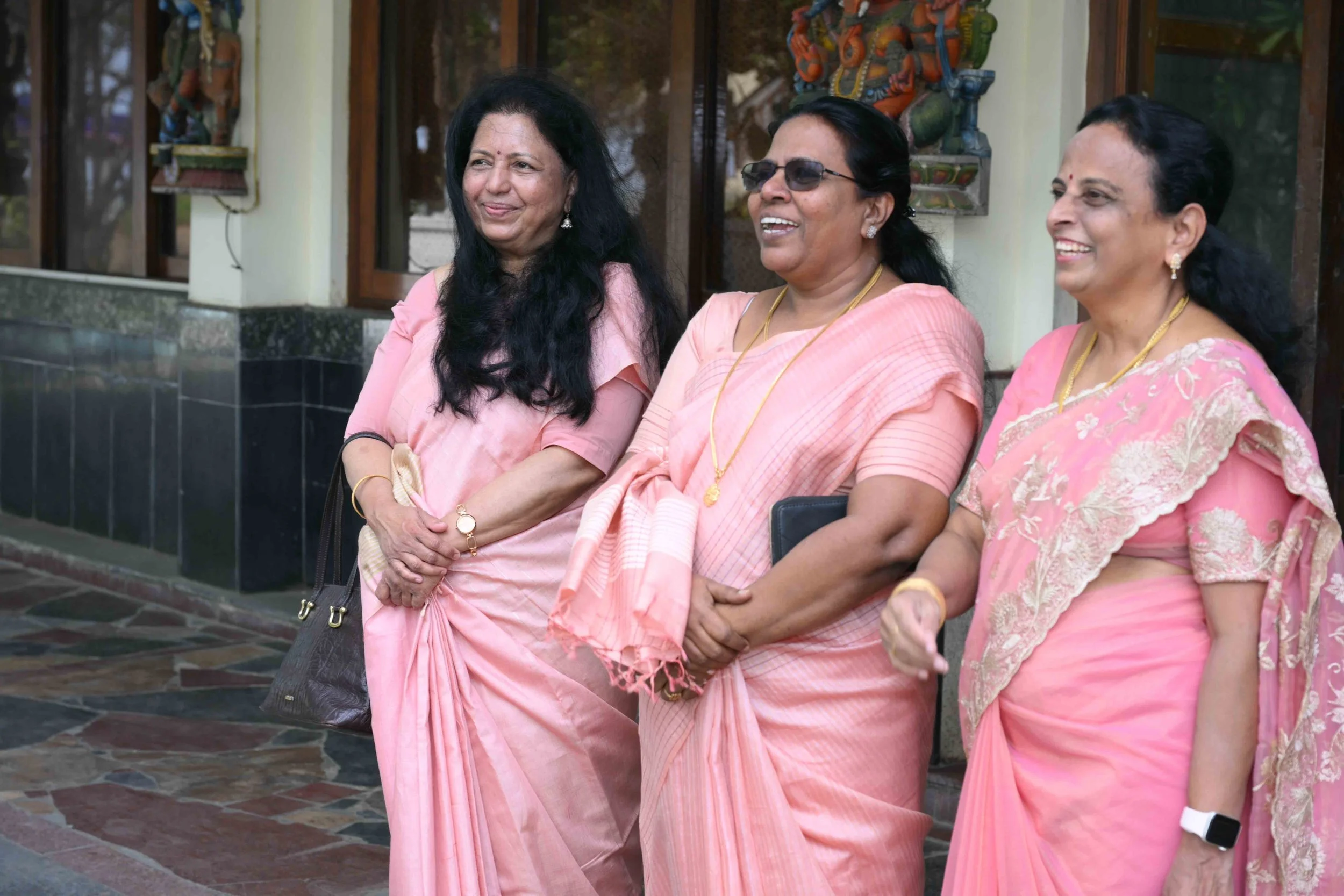 The three friends arrive in the proper dress code (Sadhana, Latha, Celine).
