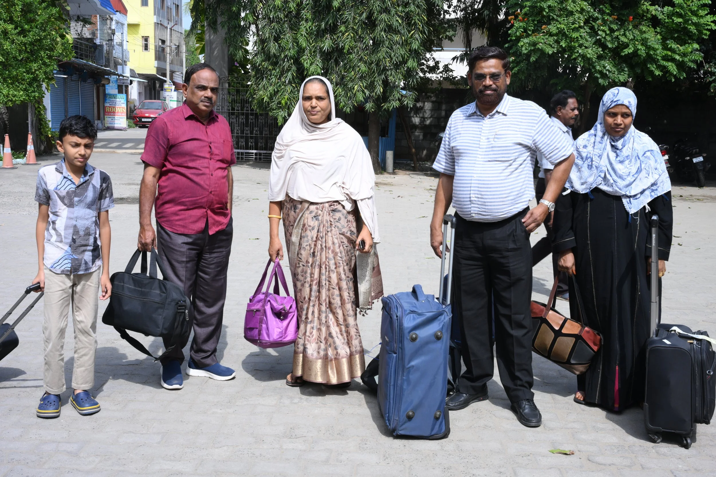 A.J and Tharvish landing with their families.