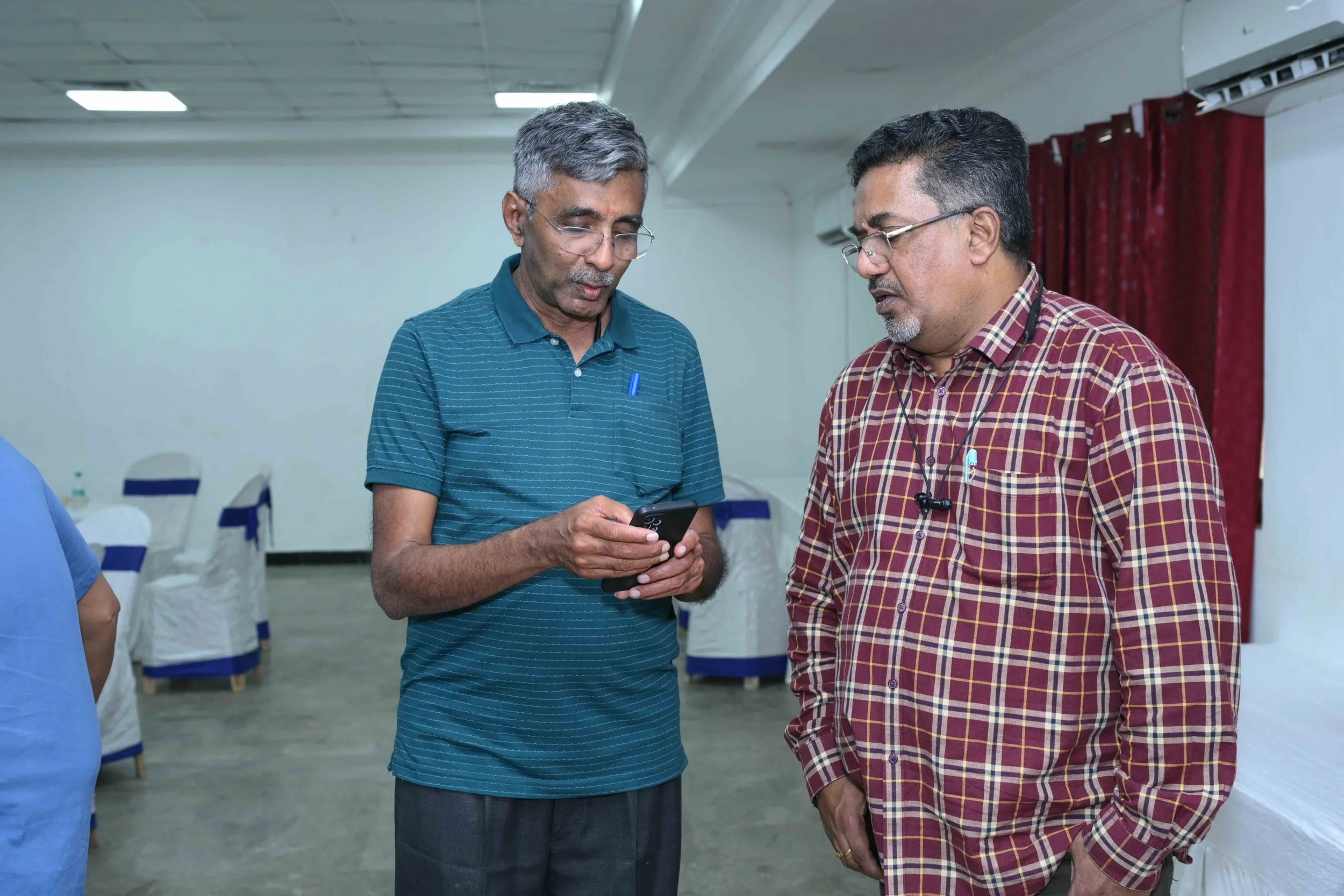 APK tells Manicks that it is time to go for the group photos.