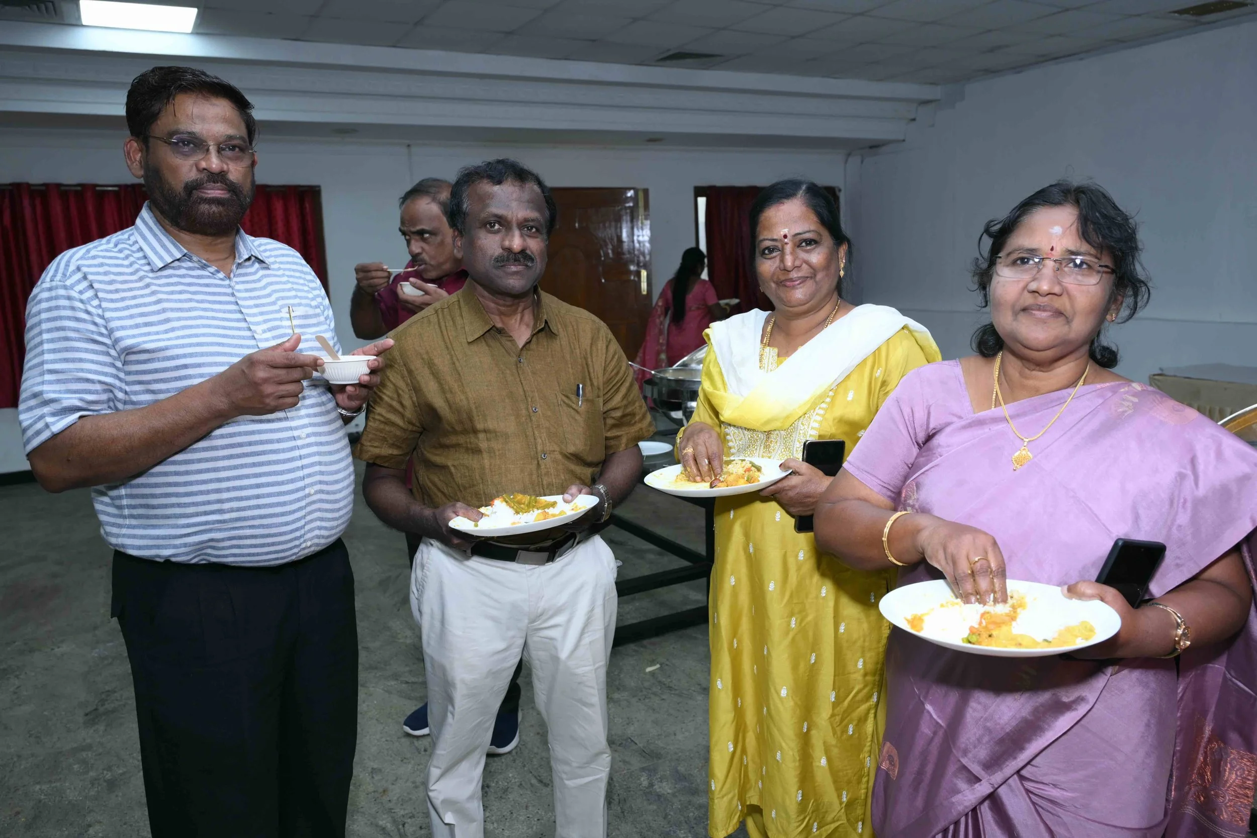 A.J, Parthasarathy, Malarvizhi and Shanthi announce "Lunch is being served".