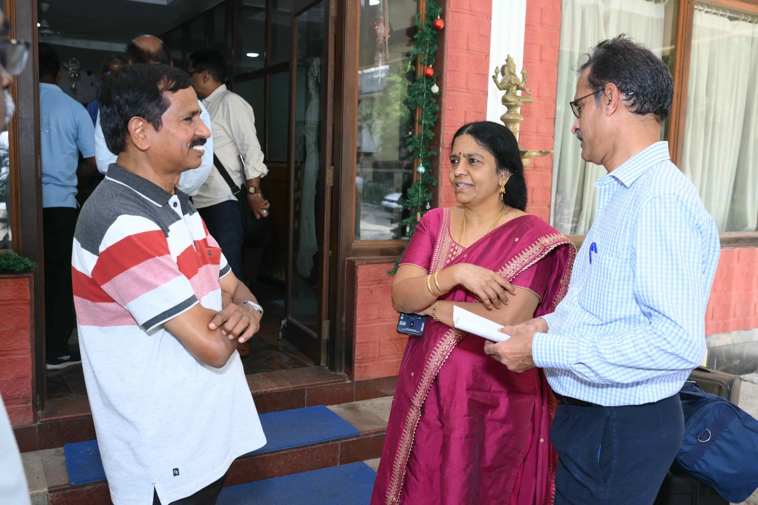 Sambandam arrives with dear wife Valli. Introduces his fellow Gulf man.