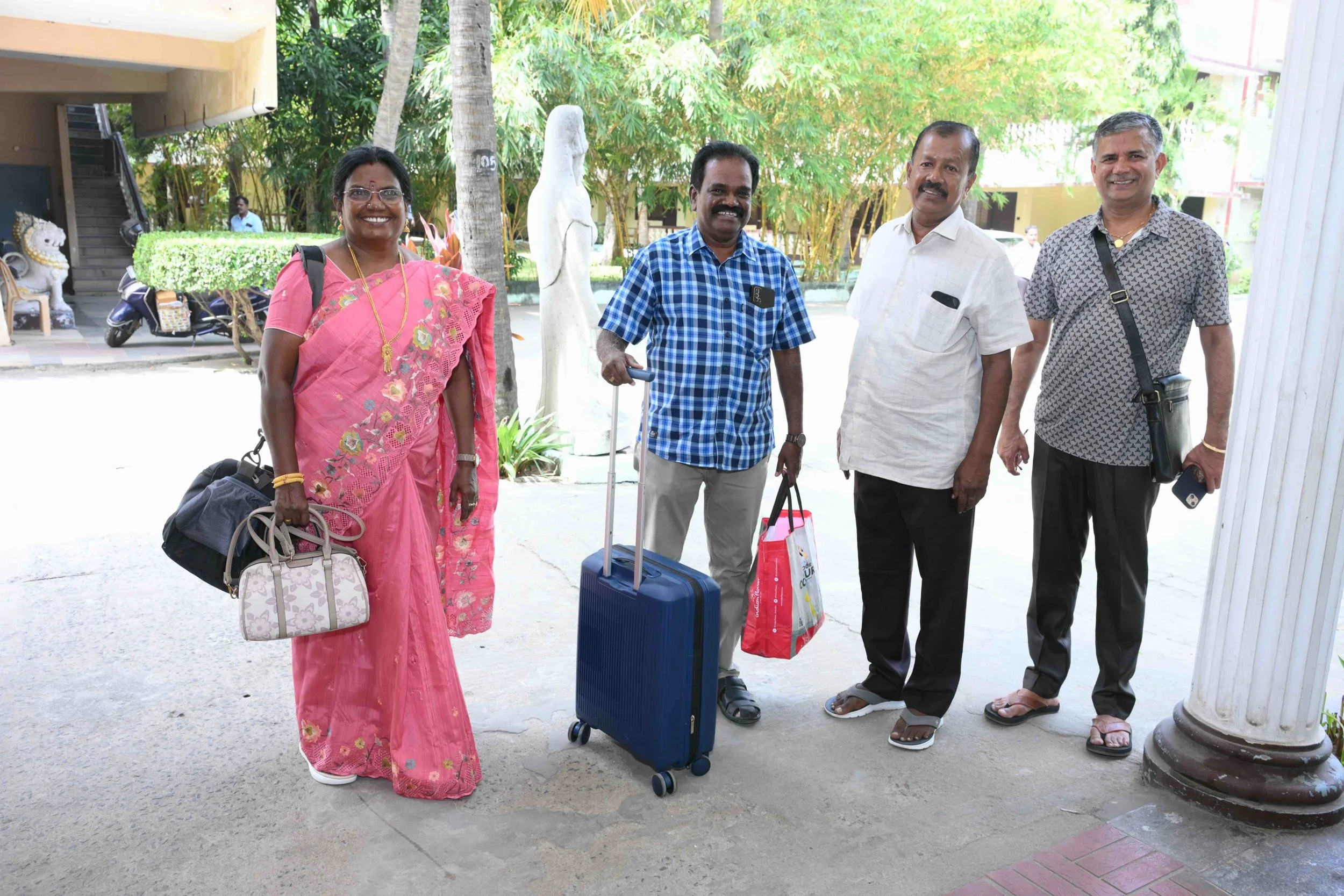 Gunasekar and Kalarani get a warm welcome by Lekshmanan and Murugesan.
