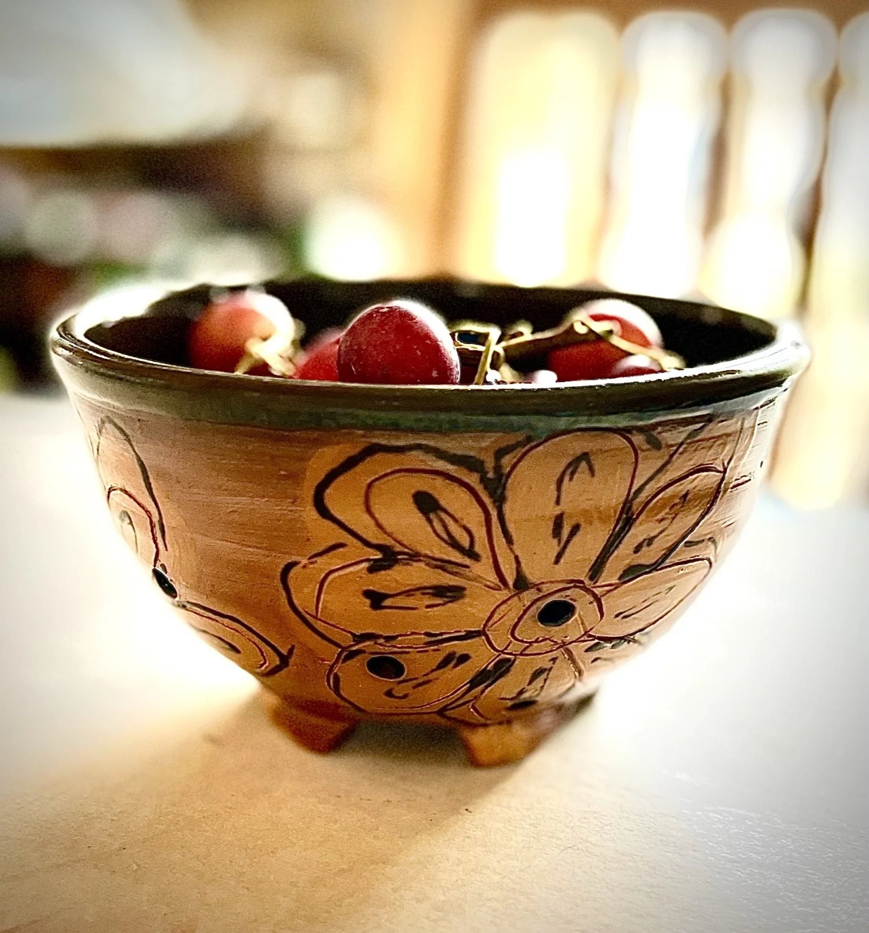 Flower decorated berry bowl with fresh washed grapes.