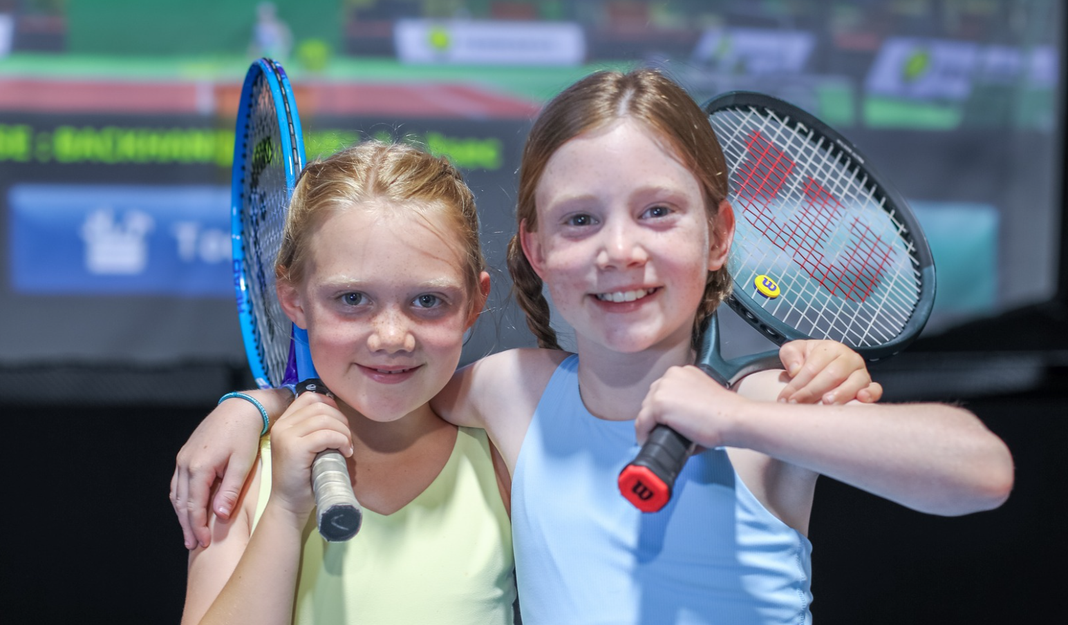 Kids playing indoor junior tennis camp in Houston at My Tennis Wall.