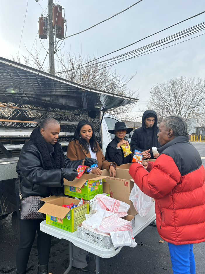  Gerri Harris (from left) of Gilbane Building, Kiera Ellis of Rise Strategy Group, and Monica Scott, Vice President of Community Engagement for Bally’s Chicago Casino, present a variety of chips and snacks to choose from during the giveaway at Parkwa