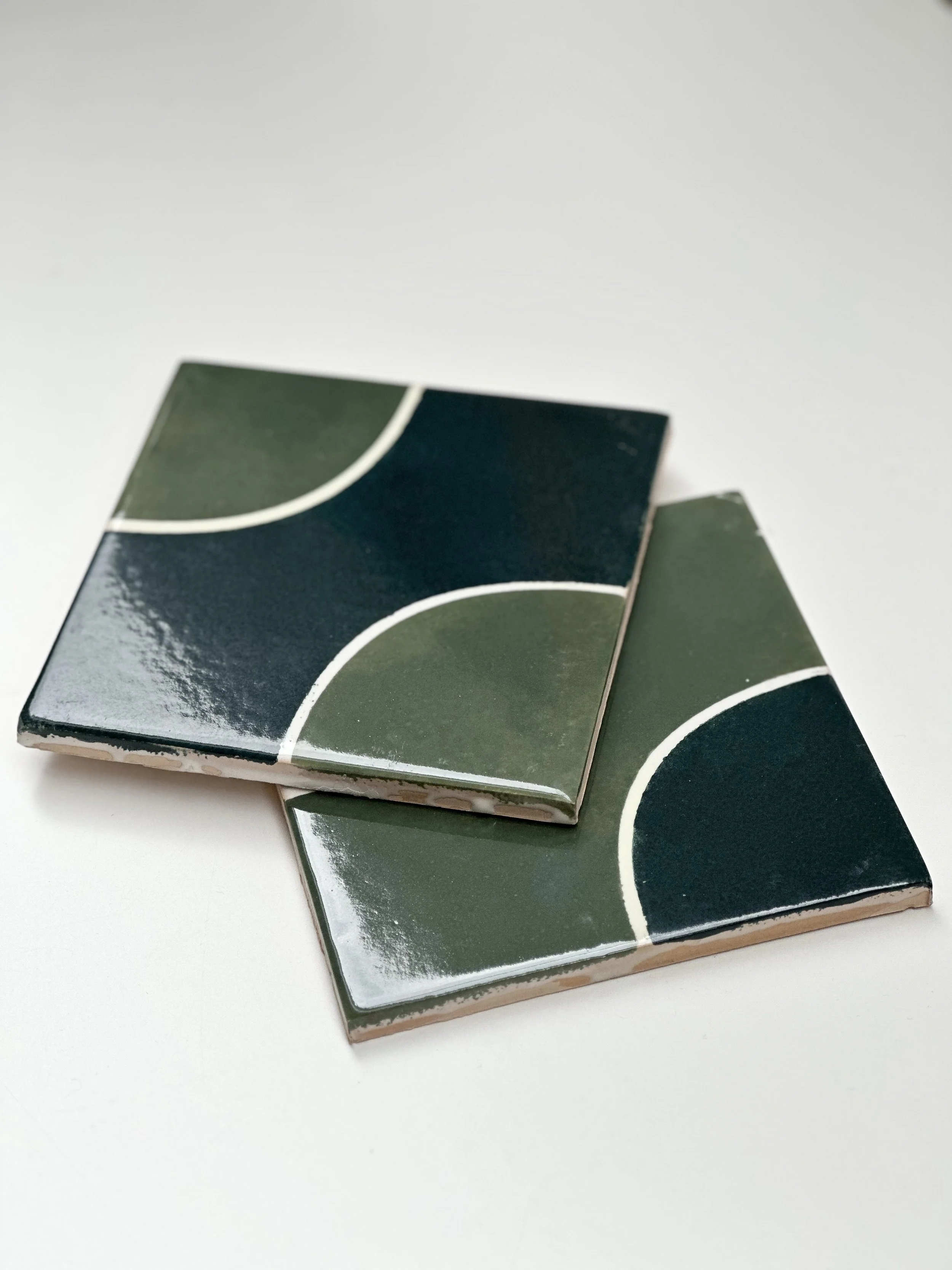 Close-up of the hand-painted green algaiarens tiles.
